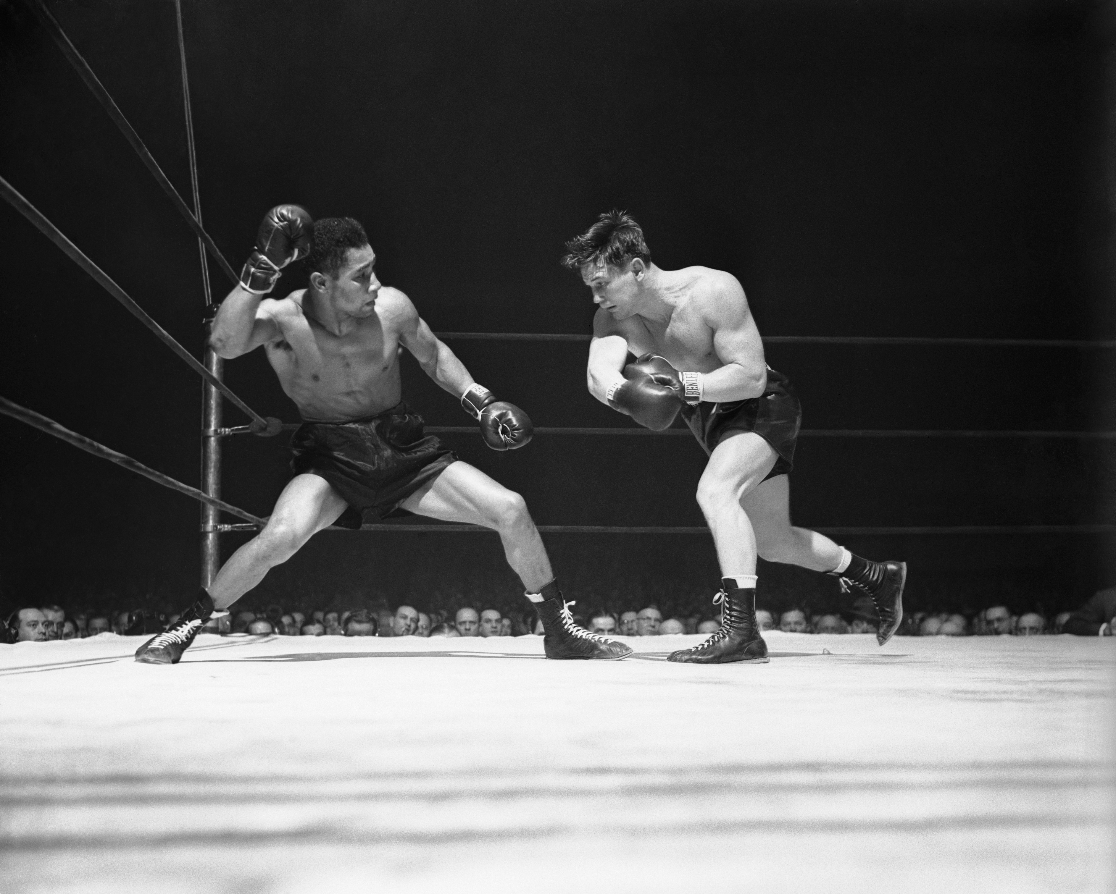 (Original Caption) Beau Jack (left) winds up for punch vs. Morris Reif. Jack won in 4th round TKO.