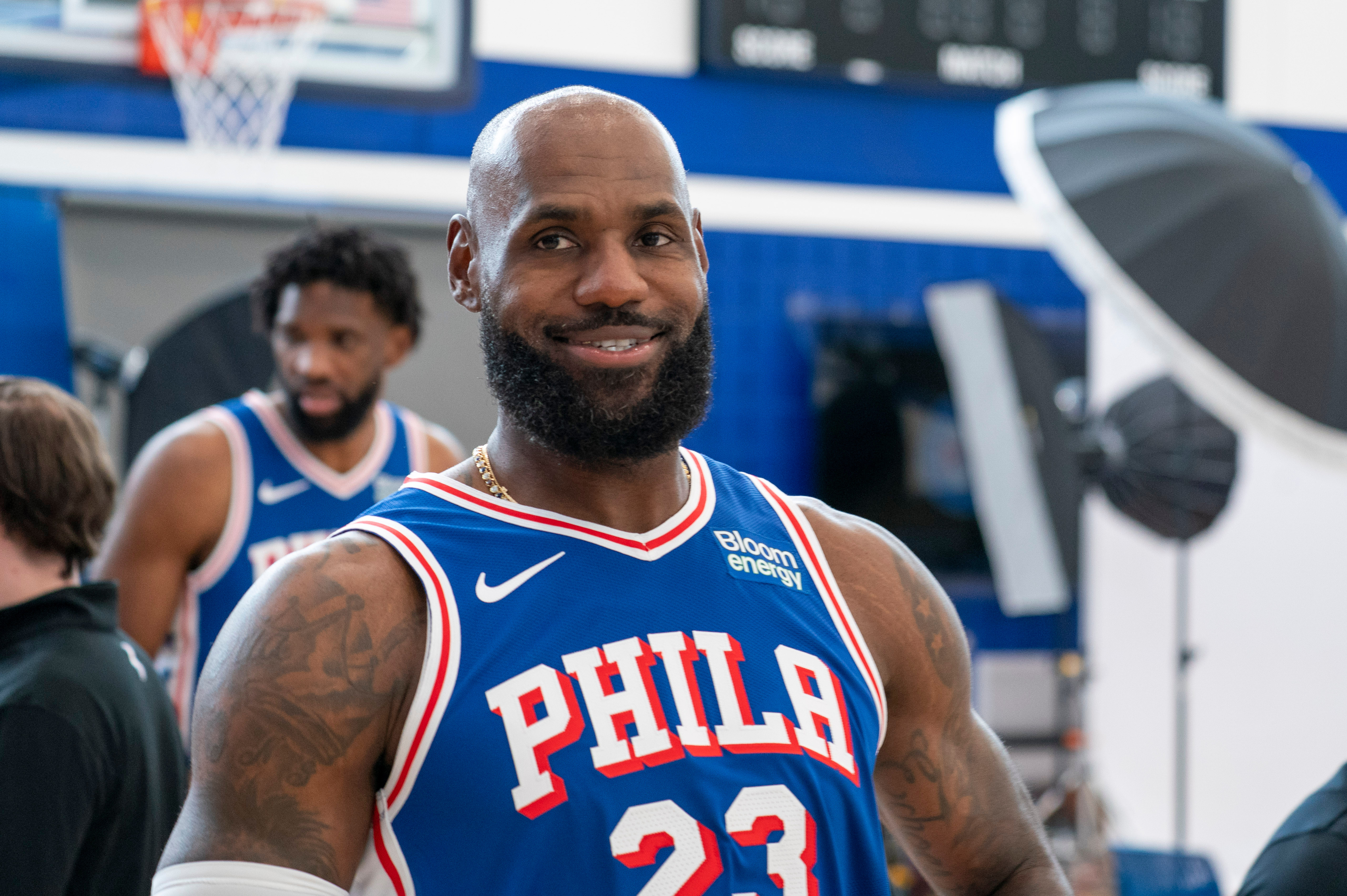 Philadelphia 76ers' LeBron James reacts as he goes between stations during the NBA basketball team's media day, Monday, Sept. 28, 2026, in Camden, N.J.. (AP Photo/Chris Szagola)