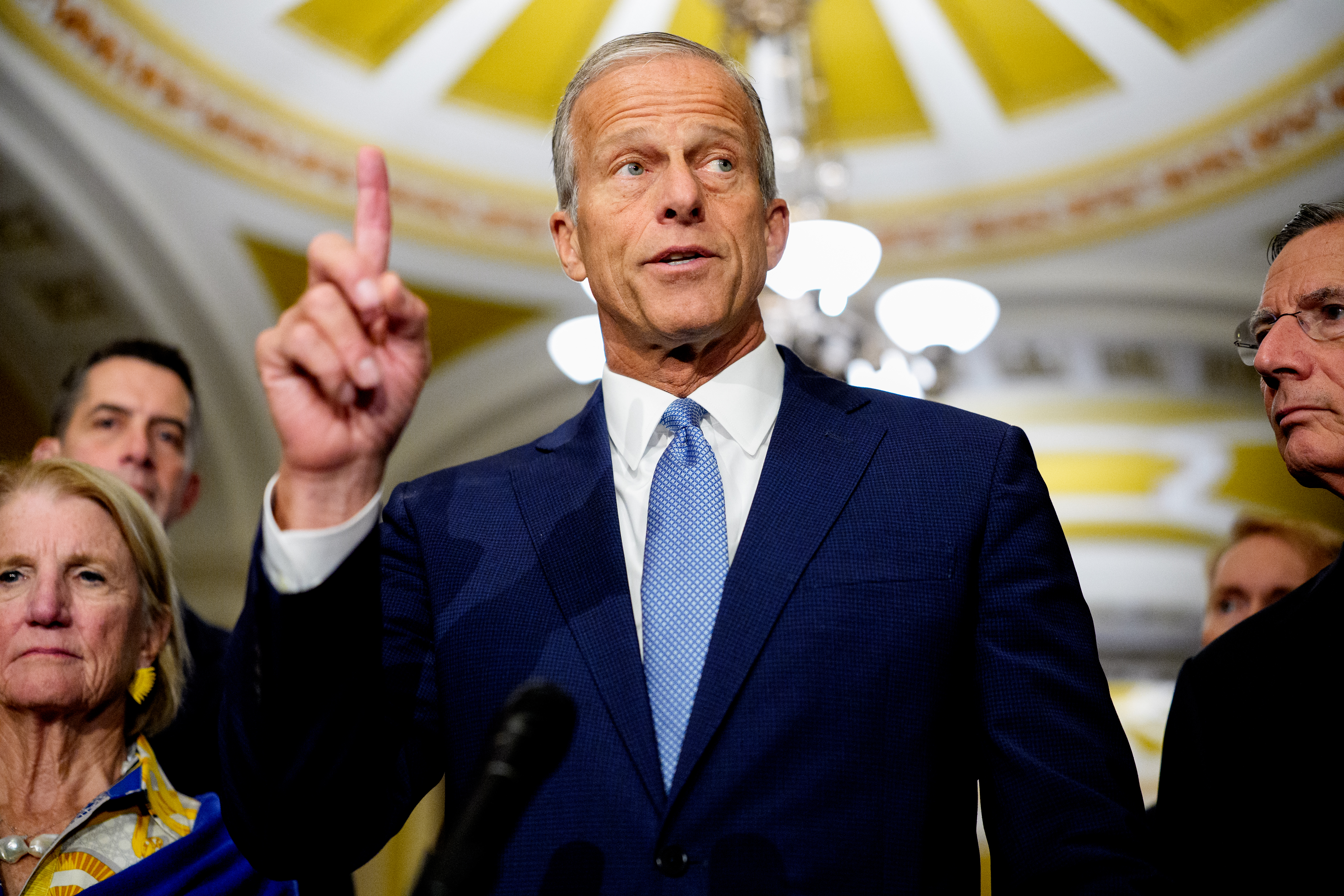 WASHINGTON, DC - SEPTEMBER 29: Senate Majority Leader John Thune (R-SD) (C), accompanied by Sen. Shelley Moore Capito (R-WV) (L), and Senate Majority Whip John Barrasso (R-WY) (R), speaks to reporters following a Republican policy luncheon at the U.S. Capitol Building on September 29, 2026 in Washington, DC. Thune discussed The Rate Payer Protection Act, midterm voter turnout, the farm bill, and other topics. (Photo by Andrew Harnik/Getty Images)