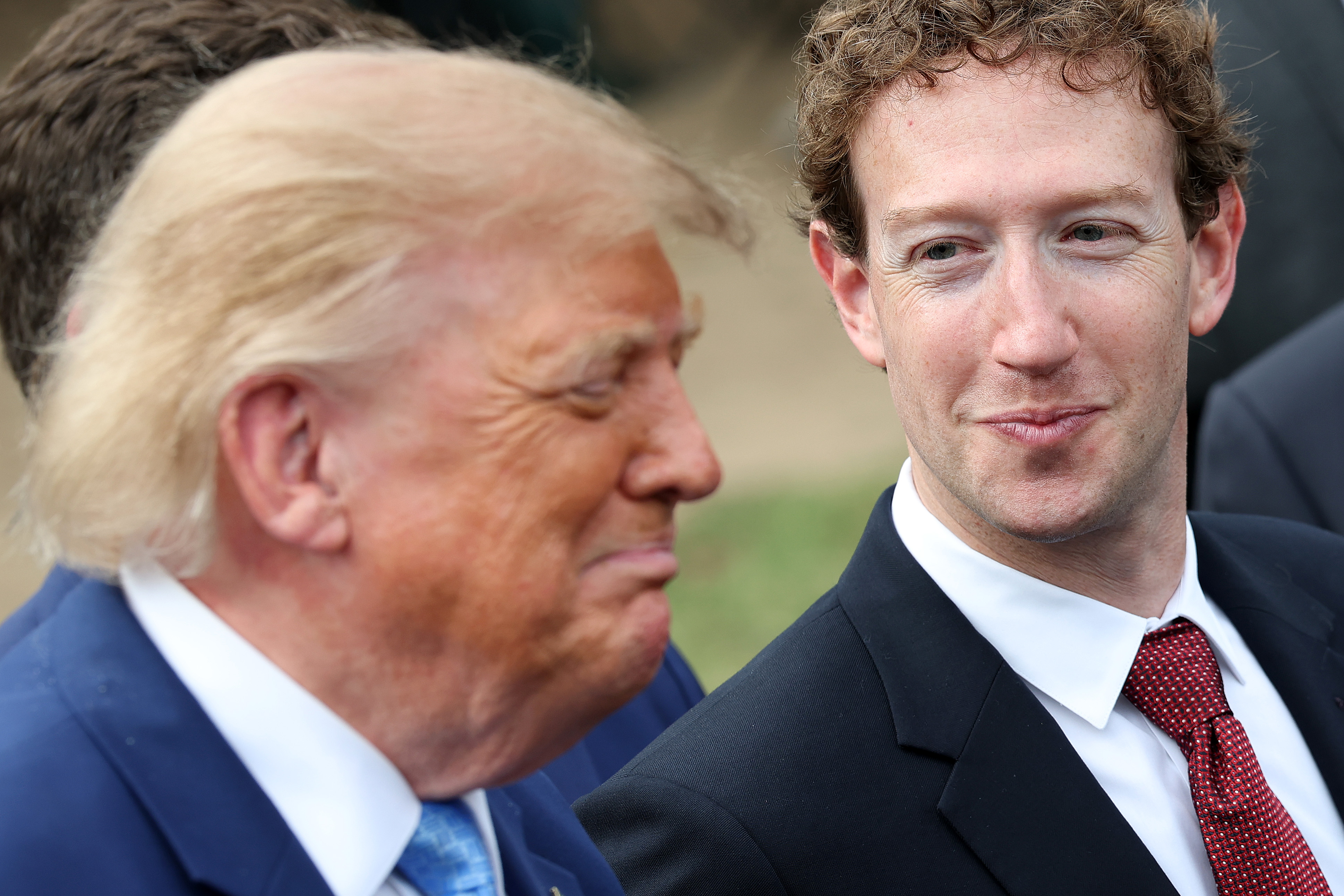 WASHINGTON, DC - SEPTEMBER 29: Mark Zuckerberg, CEO of Meta Platforms, looks to U.S. President Donald Trump as Trump holds a press briefing with AI executives following a meeting on artificial intelligence outside the West Wing of the White House on September 29, 2026 in Washington, DC. The meeting comes as some have called for a slowdown in AI development amid rising safety concerns. (Photo by Kevin Dietsch/Getty Images)