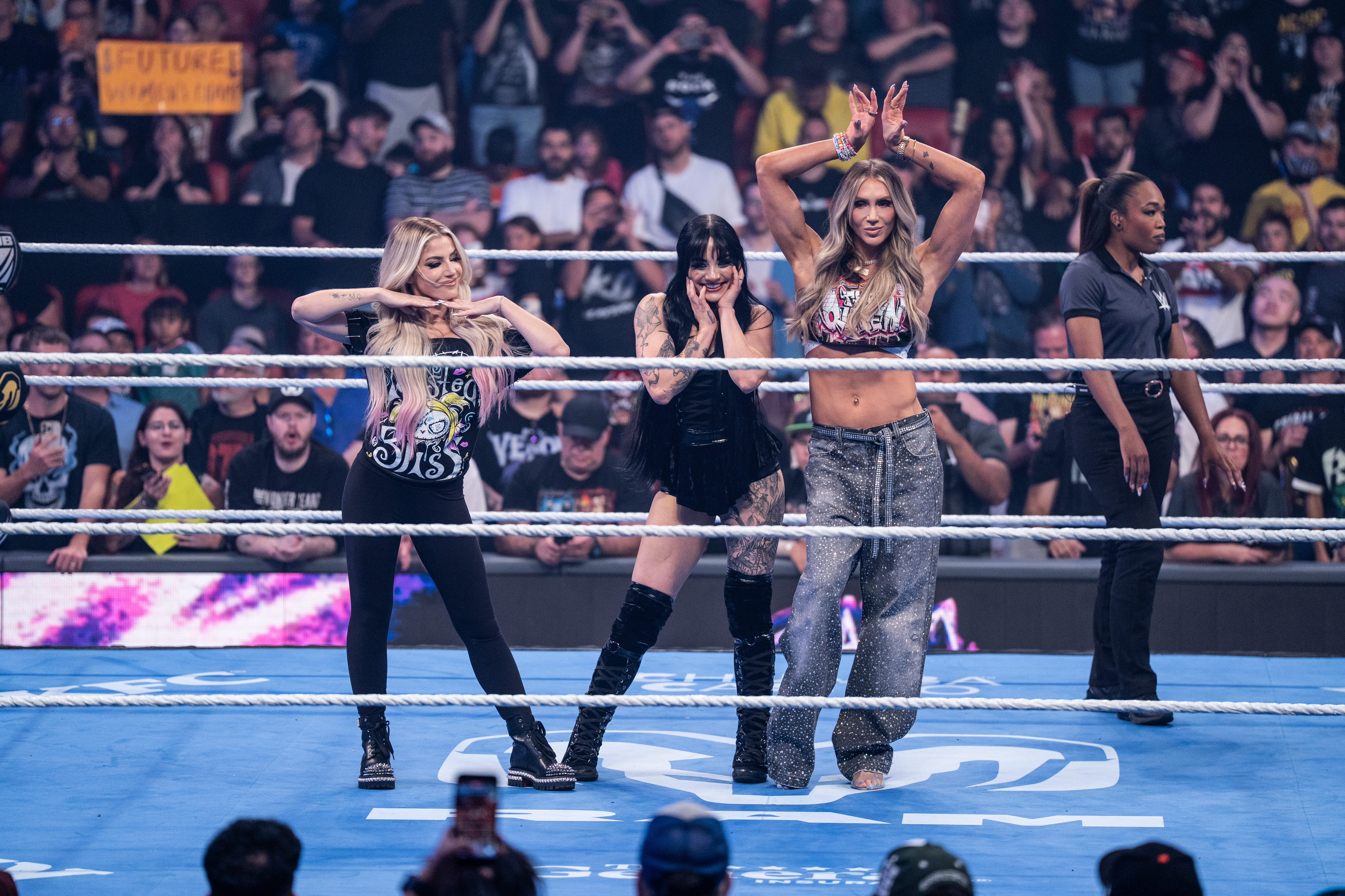 OTTAWA, ONTARIO - AUGUST 28: Tatum Paxley makes her entrance with Alexa Bliss and Charlotte Flair during SmackDown at Canadian Tire Centre on August 28, 2026 in Ottawa, Ontario. (Photo by Chloe Beaujean/WWE via Getty Images)