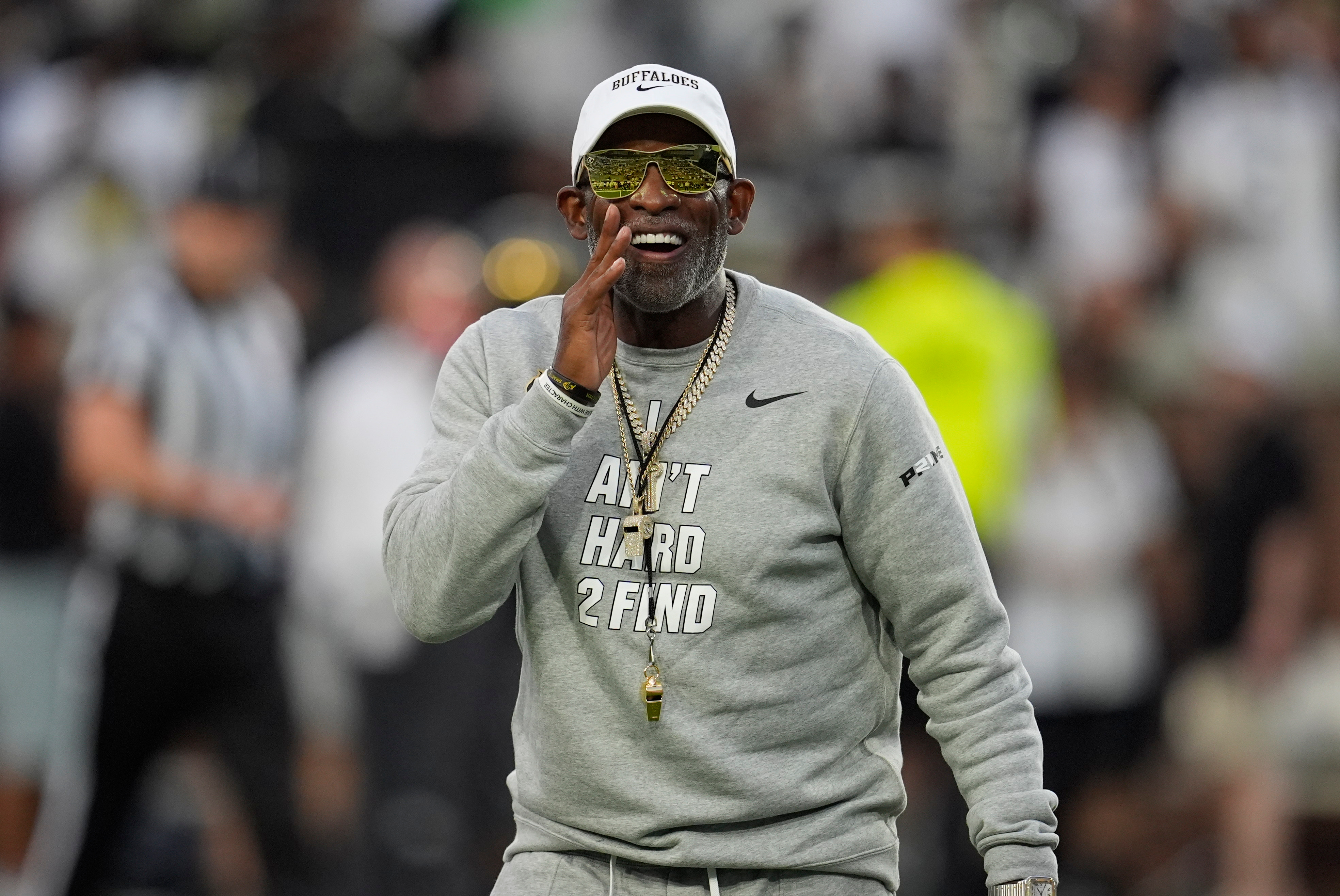 Colorado head coach Deion Sanders walks on the field before an NCAA college football game between Georgia Tech and Colorado, Thursday, Sept. 3, 2026, in Atlanta. (AP Photo/Mike Stewart)