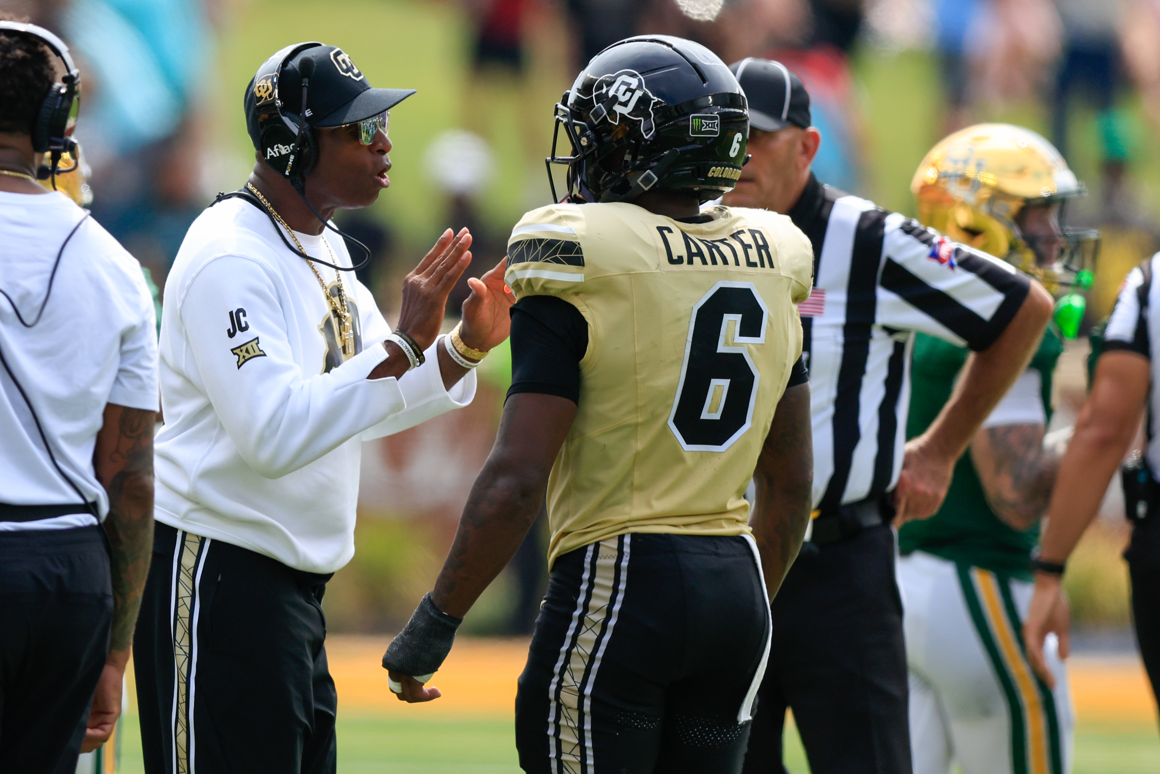 WACO, TX - SEPTEMBER 26: Head coach Deion Sanders of the Colorado Buffaloes talks with Quentin Gibson #6 of the Colorado Buffaloes after Gibson throws a punch at a Baylor player during the second half of the game on September 26, 2026, at McLane Stadium in Waco, TX. (Photo by Adam Davis/Icon Sportswire via Getty Images)