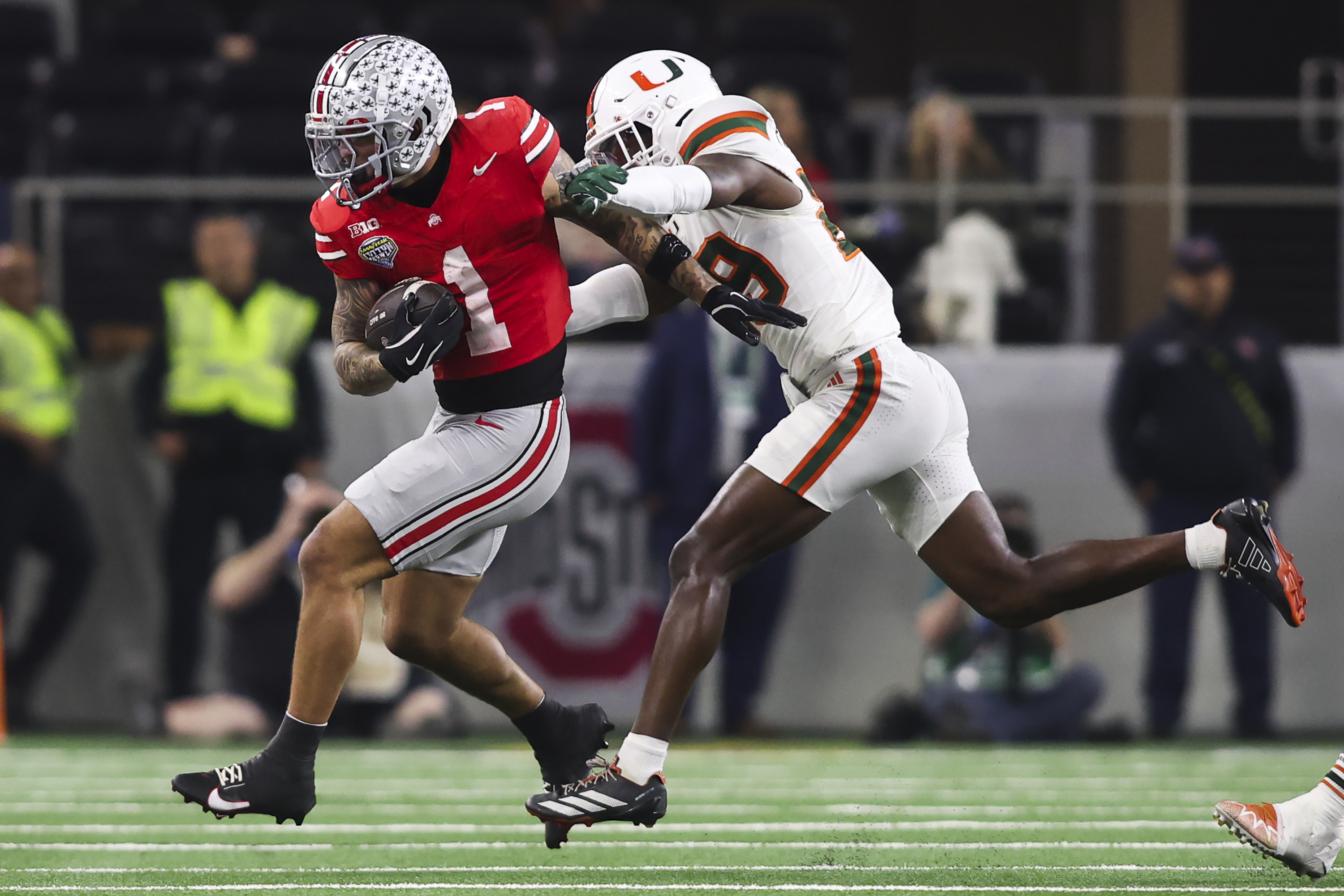 ARLINGTON, TEXAS - DECEMBER 31: Brandon Inniss #1 of the Ohio State Buckeyes runs with the ball in the second half during the College Football Playoff Quarter Final Game against the Miami Hurricanes at AT&T Stadium on December 31, 2025 in Arlington, Texas. (Photo by CFP/Getty Images)