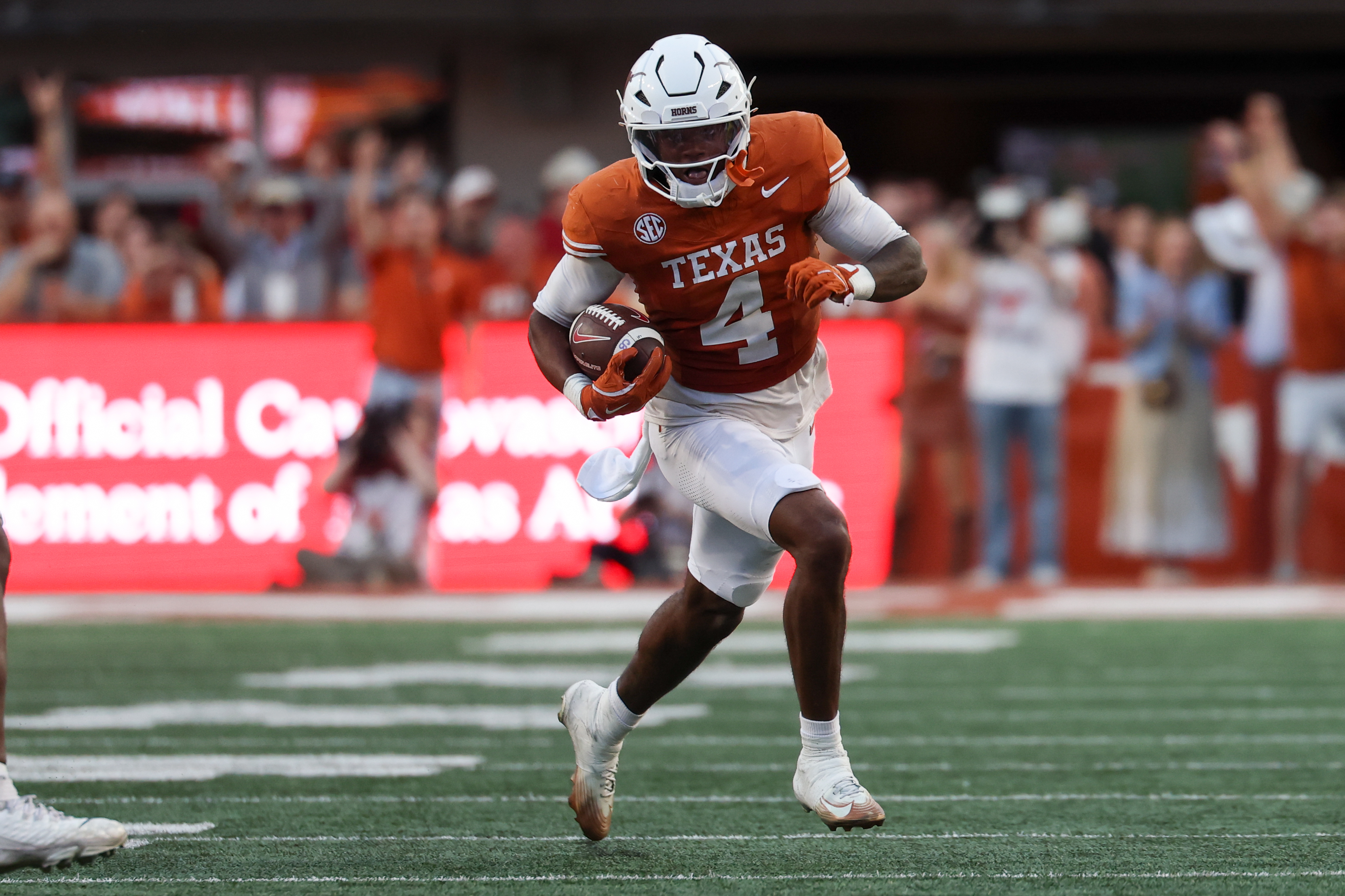 AUSTIN, TX - NOVEMBER 22: Defensive back Jelani McDonald #4 of the Texas Longhorns runs with the ball after an interception during the SEC football game between Texas Longhorns and Arkansas Razorbacks on November 22, 2025, at Darrell K Royal-Texas Memorial Stadium in Austin, TX. (Photo by David Buono/Icon Sportswire via Getty Images)
