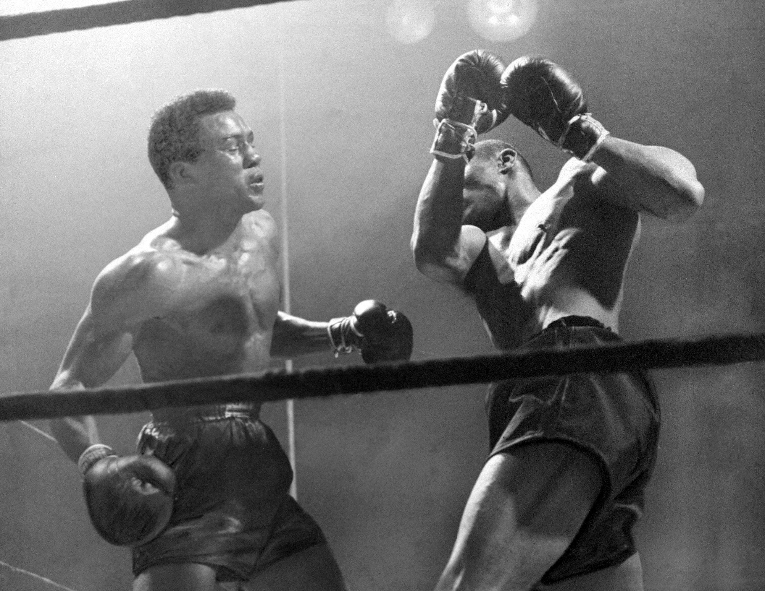 UNITED STATES - MARCH 04:  Boxers Beau Jack (left) and Bob Montgomery slug it out at Madison Square Garden for the lightweight championship of the world. Beau Jack lost the title.  (Photo by Hank Olen/NY Daily News Archive via Getty Images)