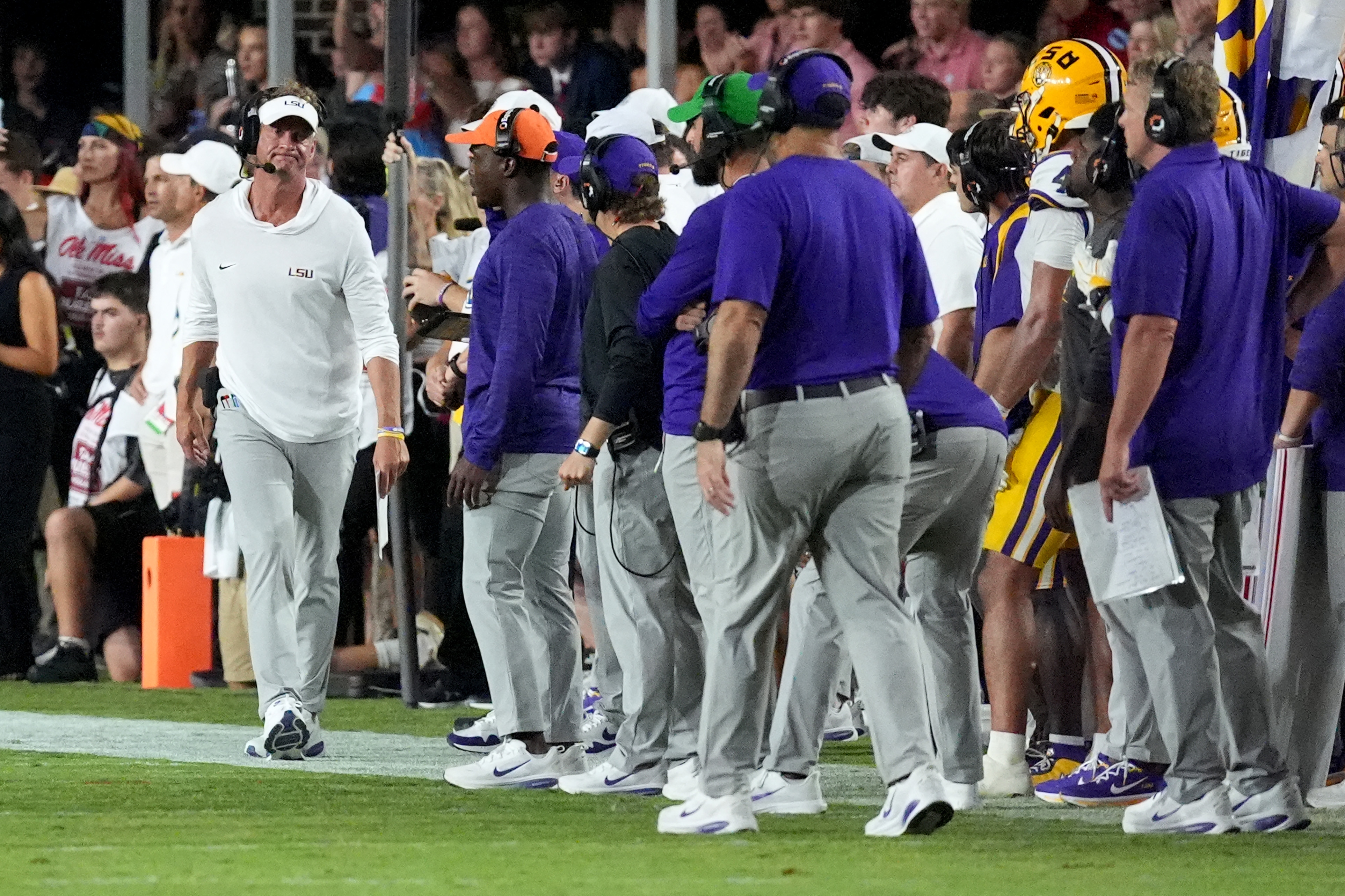LSU head coach Lane Kiffin, left, shows his disappointment to his staff as they lose to Mississippi during an NCAA college football game in Oxford, Miss., Saturday, Sept. 19, 2026. (AP Photo/Rogelio V. Solis)