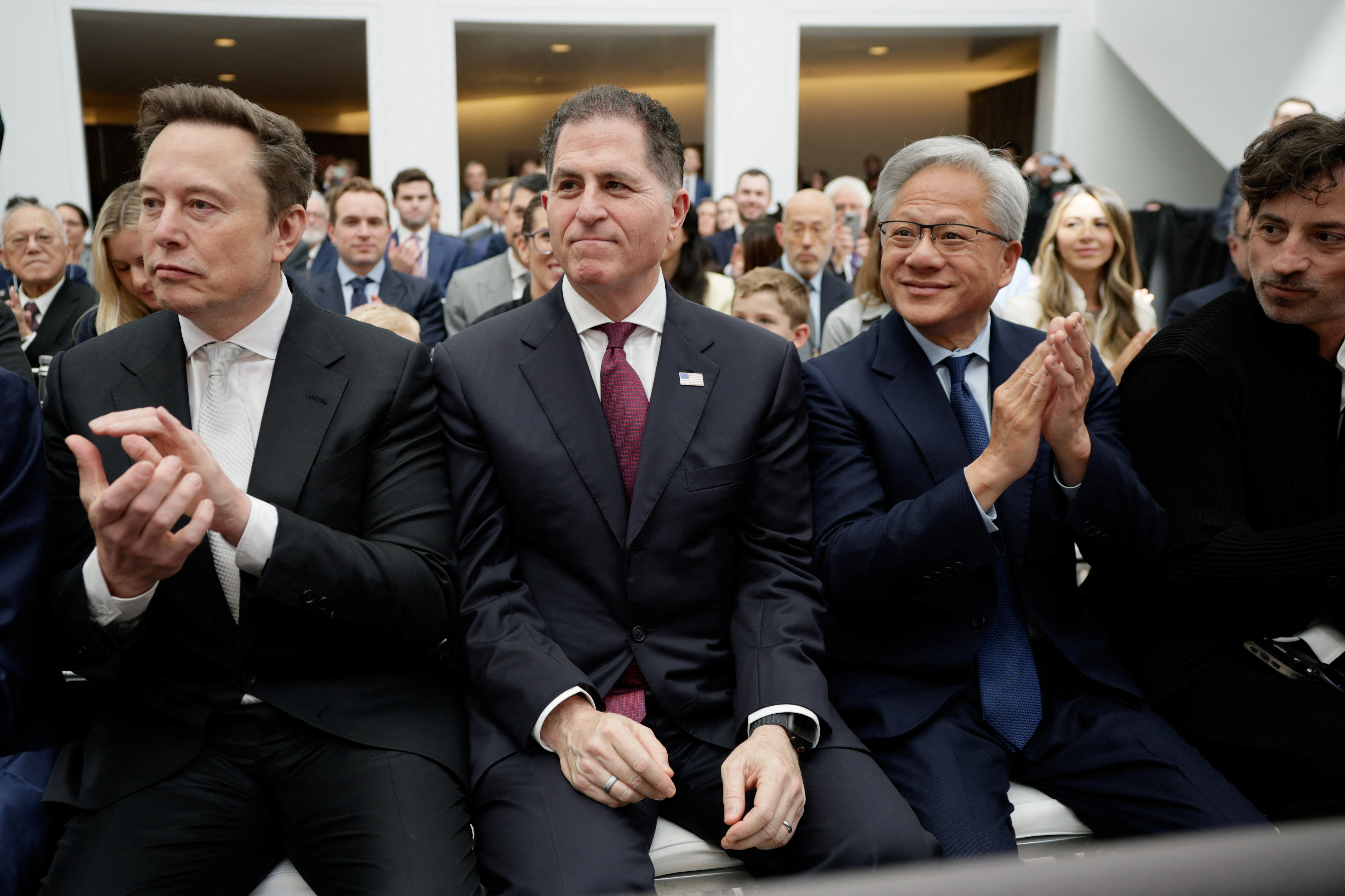Tesla and SpaceX CEO Elon Musk, Dell Technologies CEO Michael Dell, and NVIDIA CEO Jensen Huang attend the "A New Golden Age" summit at the US Institute of Peace, renamed The Donald J. Trump Institute of Peace by the Trump administration, in Washington, DC, US, October 8, 2026. REUTERS/Evan Vucci