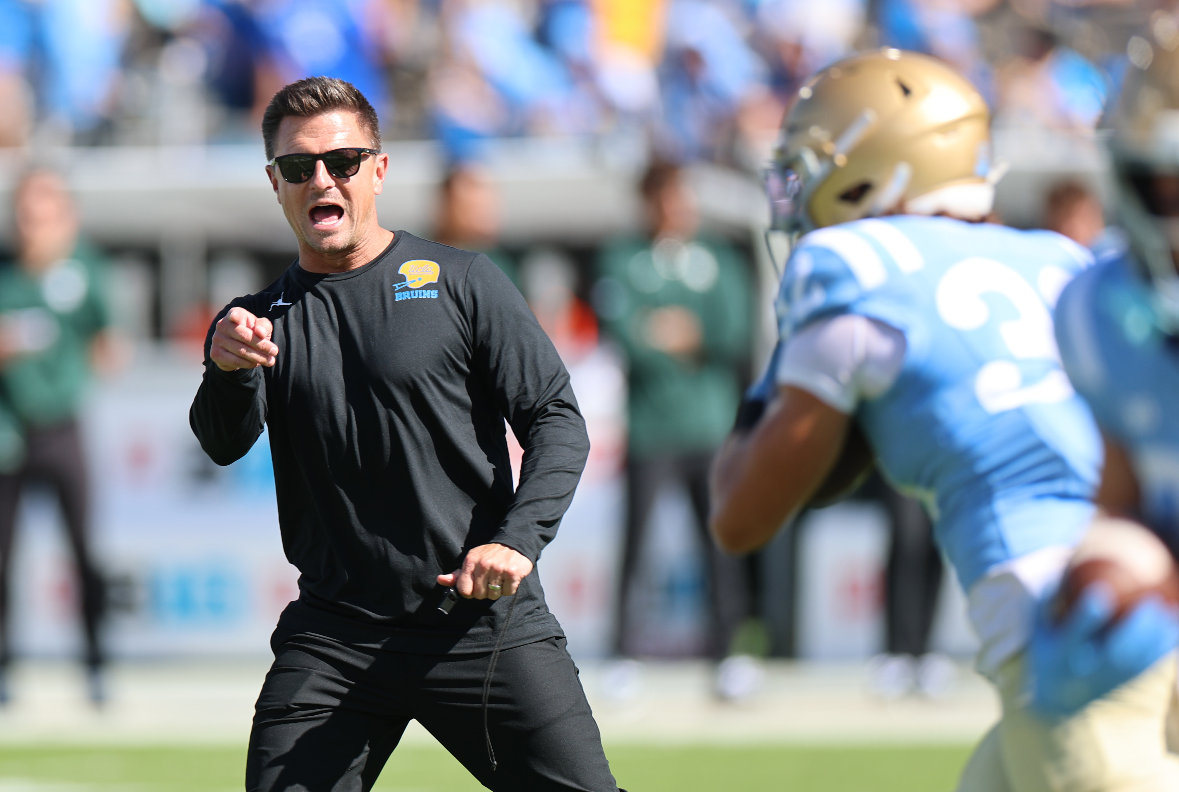 Pasadena, CA - October 24, 2026: UCLA head coach Bob Chesney works with players before a game with Michigan State at the Rose Bowl in Pasadena Saturday, October 24, 2026.  (Allen J. Schaben / Los Angeles Times via Getty Images)