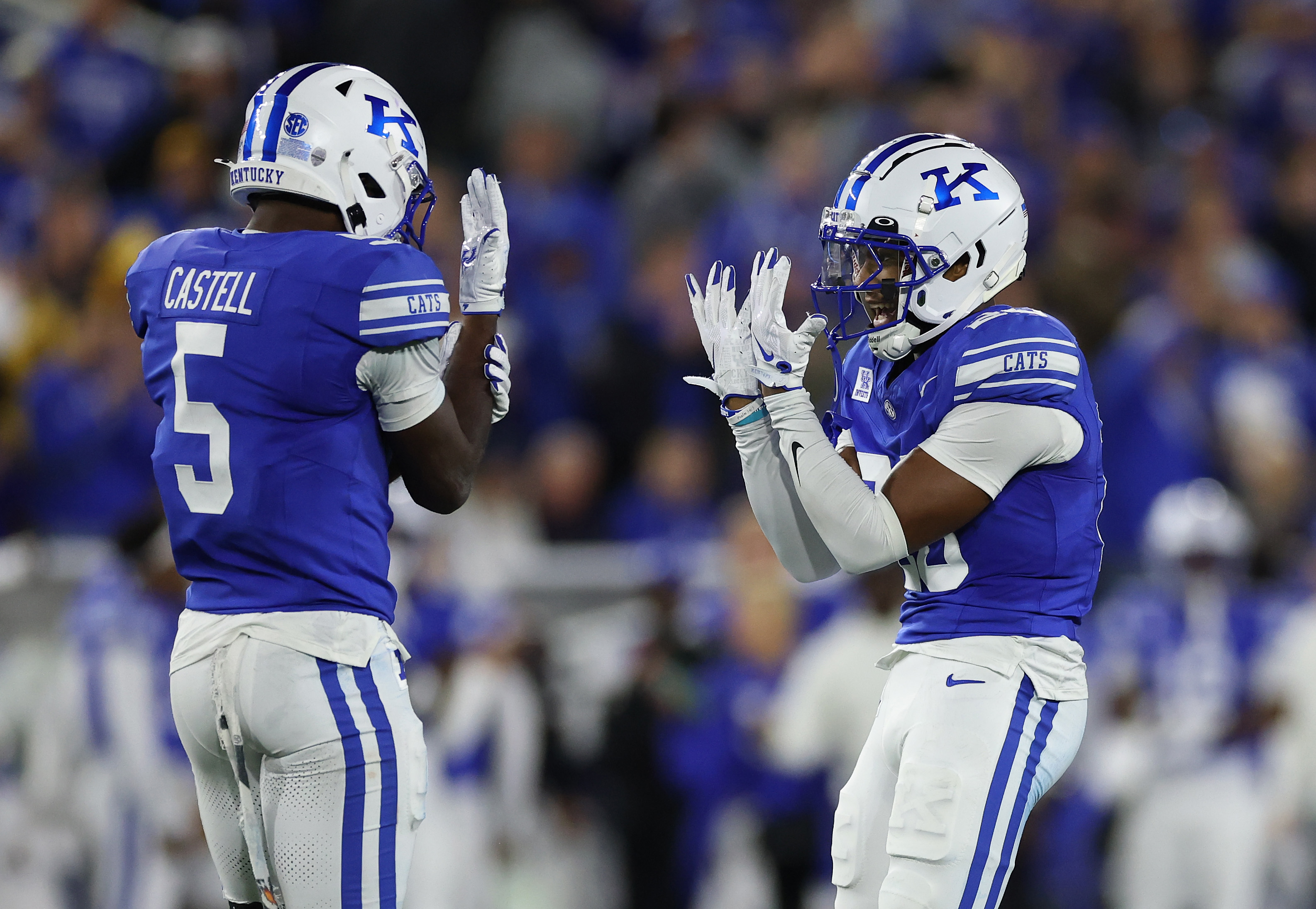 LEXINGTON, KENTUCKY - OCTOBER 10: Jordan Castell #5 and Terhyon Nichols #20 of the Kentucky Wildcats celebrate after a defensive stop against the LSU Tigers at Kroger Field on October 10, 2026 in Lexington, Kentucky. (Photo by Andy Lyons/Getty Images)