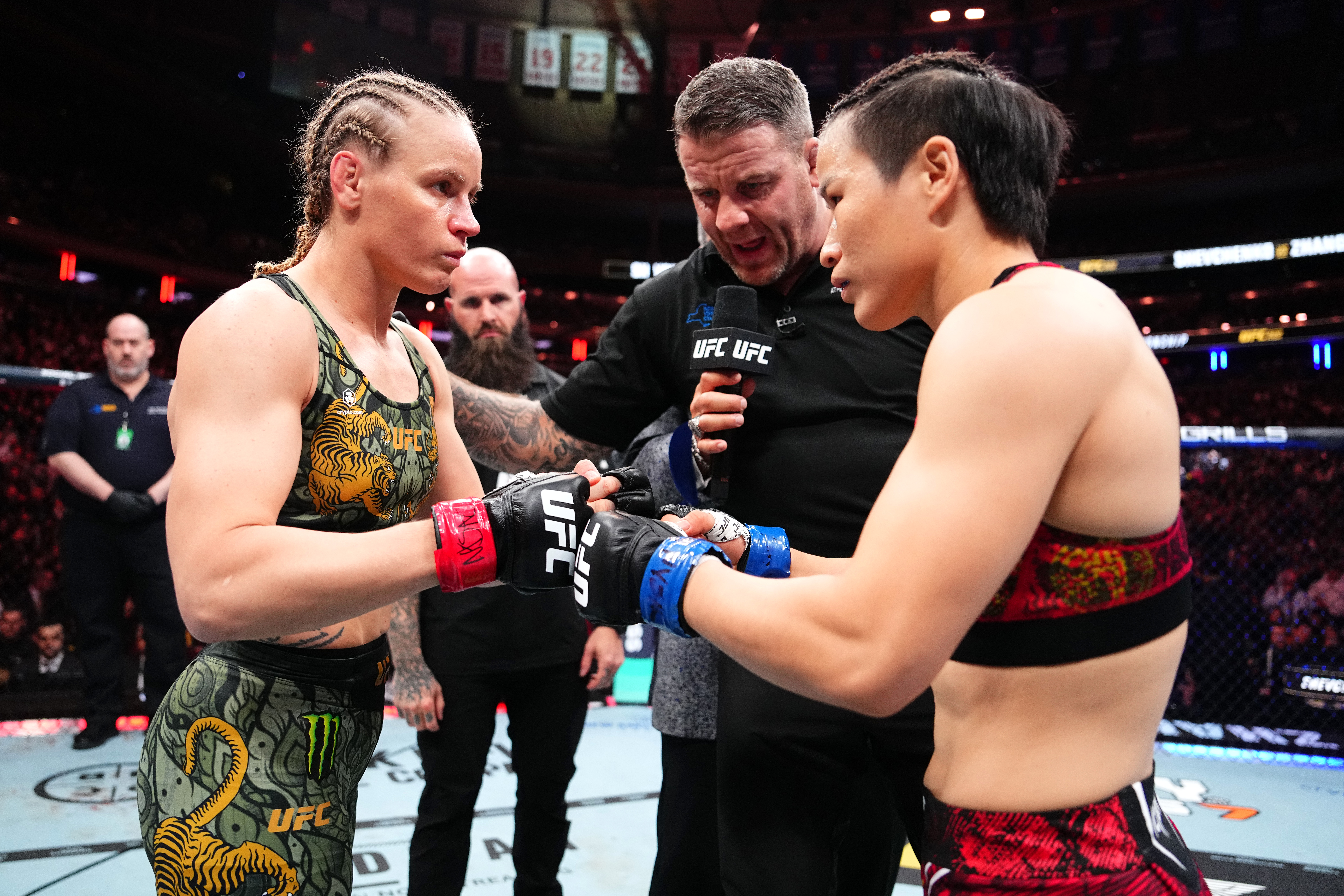NEW YORK, NEW YORK - NOVEMBER 15: (L-R) Valentina Shevchenko of Kyrgyzstan and Zhang Weili of China touch gloves in the UFC flyweight championship fight during the UFC 322 event at Madison Square Garden on November 15, 2025 in New York City. (Photo by Jeff Bottari/Zuffa LLC)