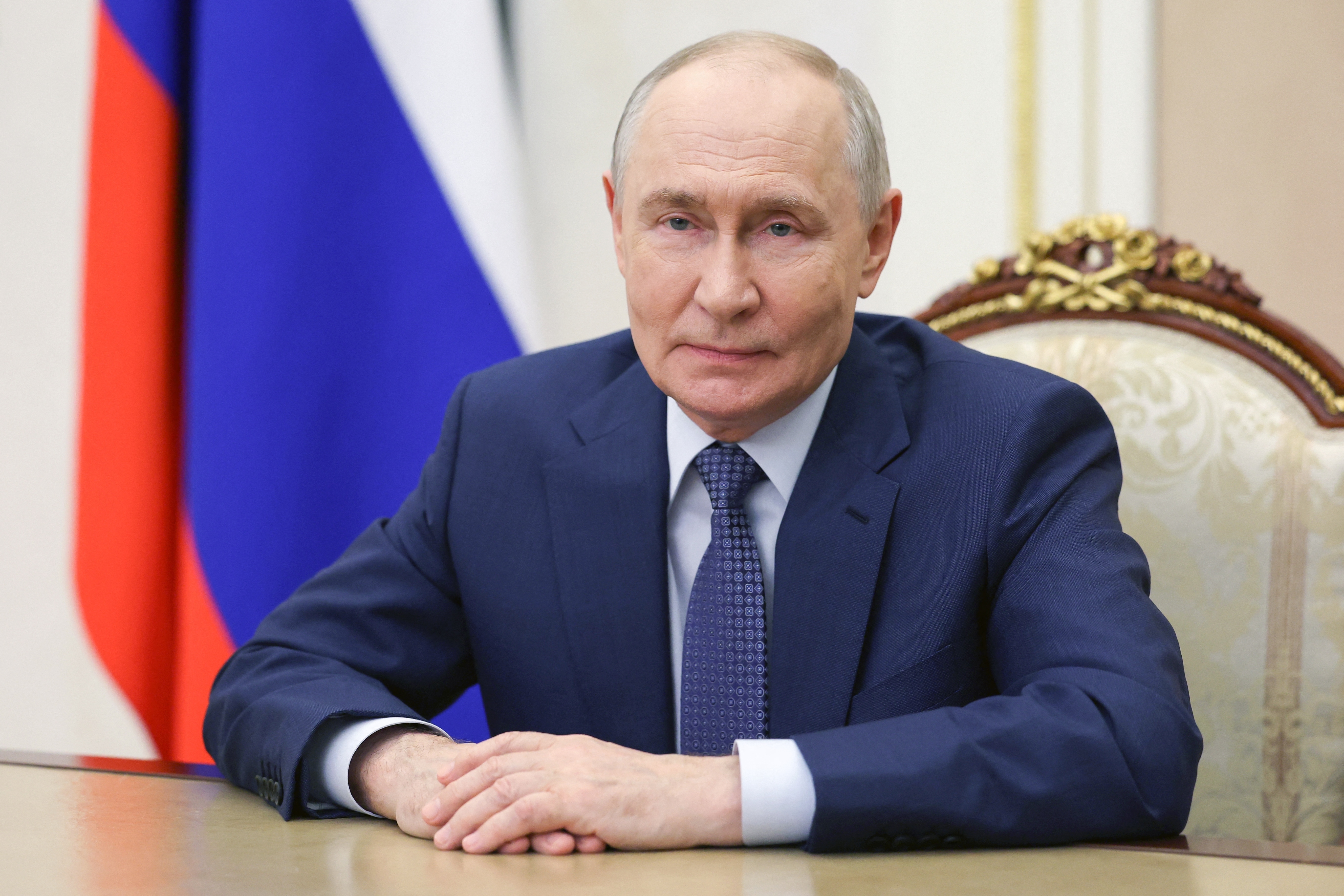 In this pool photograph distributed by the Russian state agency Sputnik, Russia's President Vladimir Putin addresses the workers in the agricultural sector on their professional holiday, the Day of the Agricultural and Processing Industry Worker, in Moscow on October 11, 2026. (Photo by Vyacheslav PROKOFYEV / POOL / AFP via Getty Images)