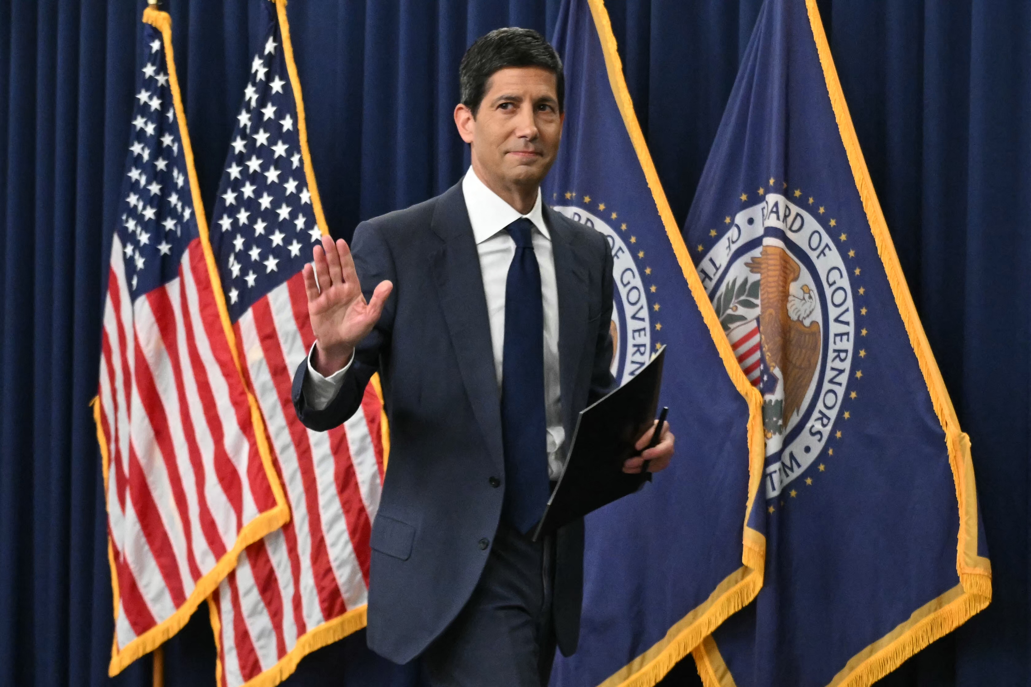 US Federal Reserve Chair Kevin Warsh departs after speaking during a press conference following the Federal Open Market Committee's interest-rate decision in Washington, DC, on October 28, 2026. The US Federal Reserve on October 28 held interest rates steady, in line with market expectations, days ahead of crucial midterm elections where surging inflation has been a key issue. The 12-member Federal Open Market Committee voted 10-2 to hold rates at a target range between 3.75 percent and 4.00 percent, citing the need for more data in the fight against price increases. Policymakers raised rates for the first time in three years at their previous meeting in September. (Photo by SAUL LOEB / AFP via Getty Images)