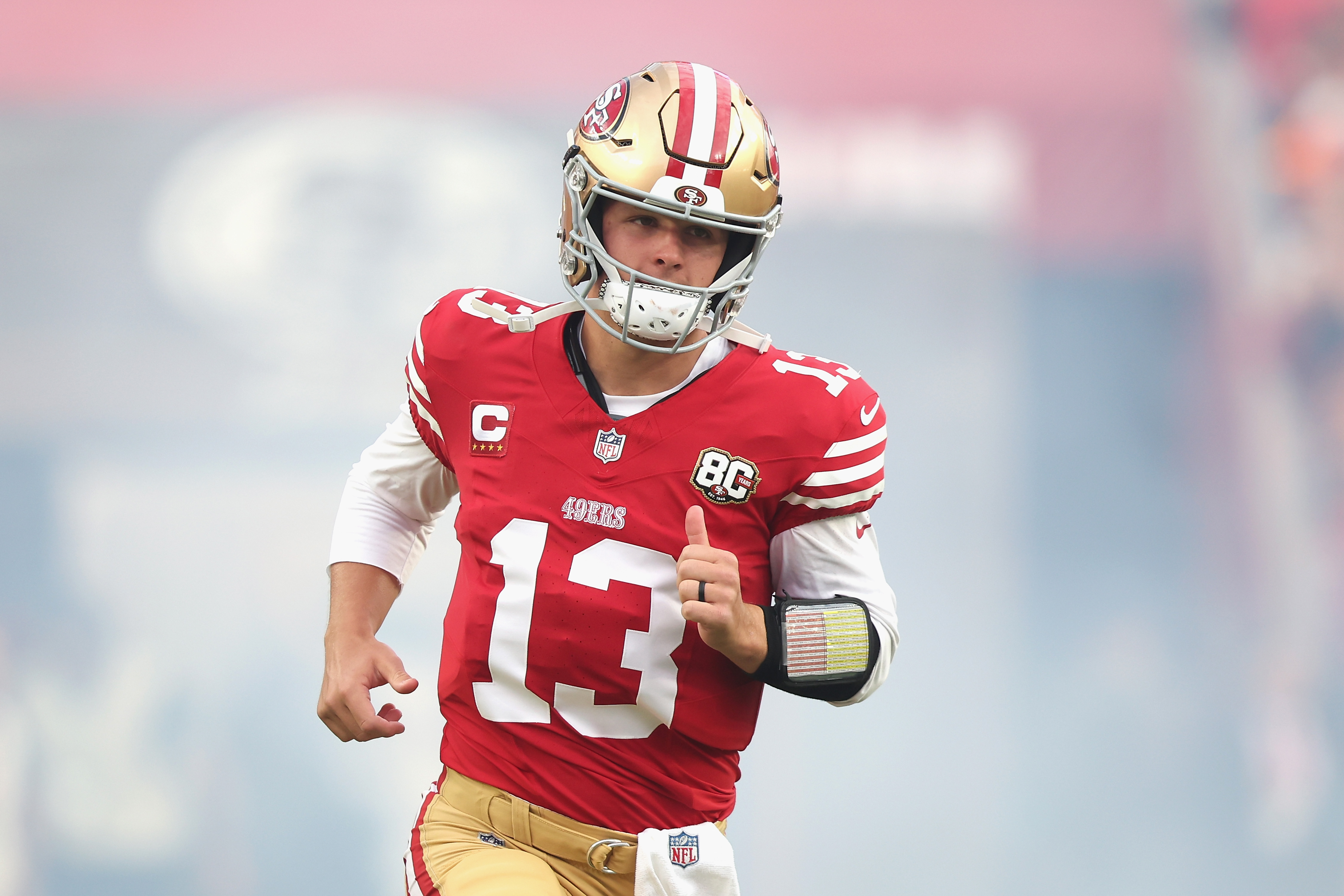SANTA CLARA, CALIFORNIA - OCTOBER 19: Brock Purdy #13 of the San Francisco 49ers enters the field during player introductions before the game against the Washington Commanders at Levi's Stadium on October 19, 2026 in Santa Clara, California. (Photo by Lachlan Cunningham/Getty Images)