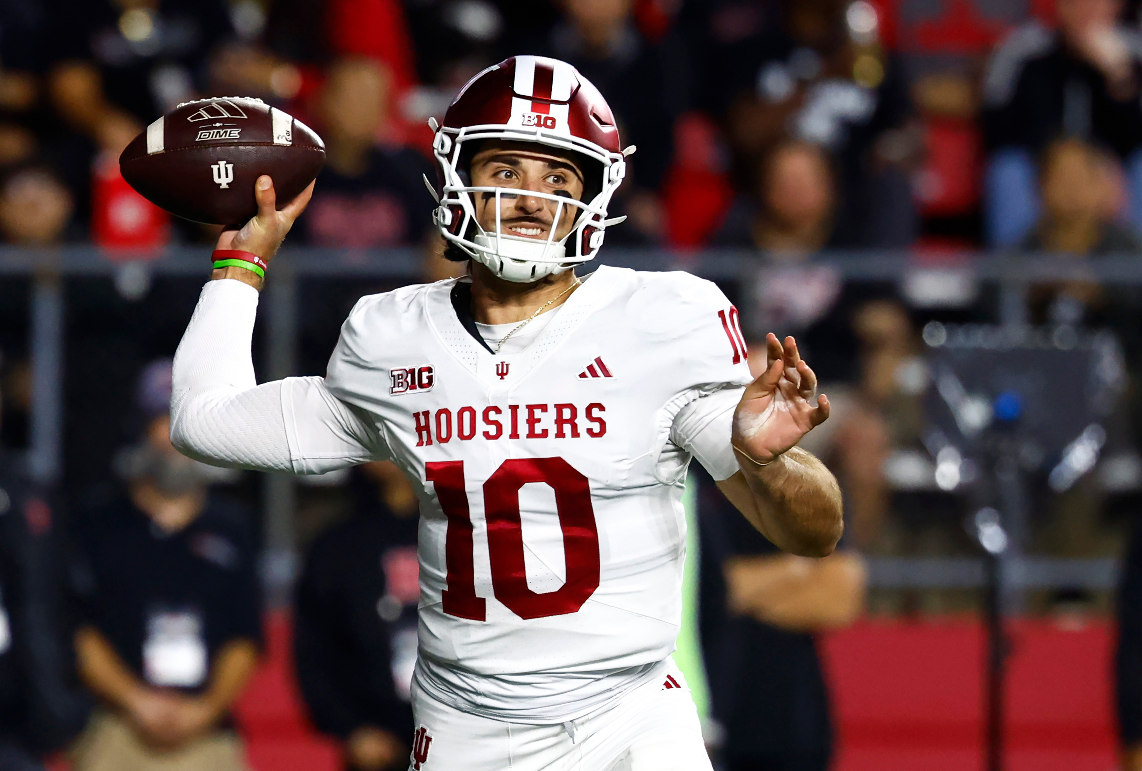 Indiana quarterback Josh Hoover (10) throws a pass during the first half of an NCAA college football game against Rutgers, Saturday, Oct. 3, 2026, in Piscataway, N.J. (AP Photo/Noah K. Murray)