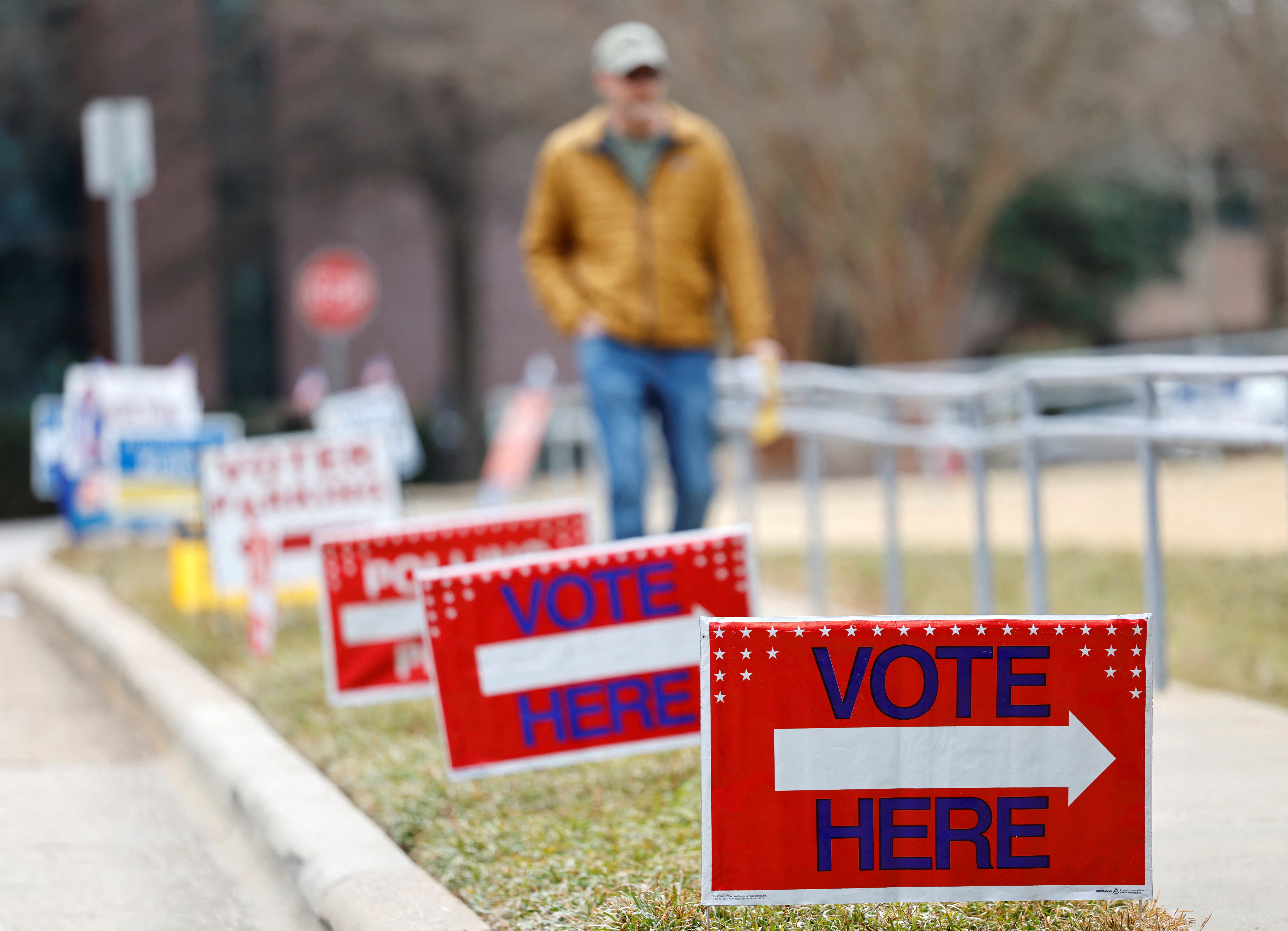 A voter walks towards his polling place during the state's primary election to choose candidates for the November midterm elections, in Cary, North Carolina, U.S., March 3, 2026.  REUTERS/Jonathan Drake