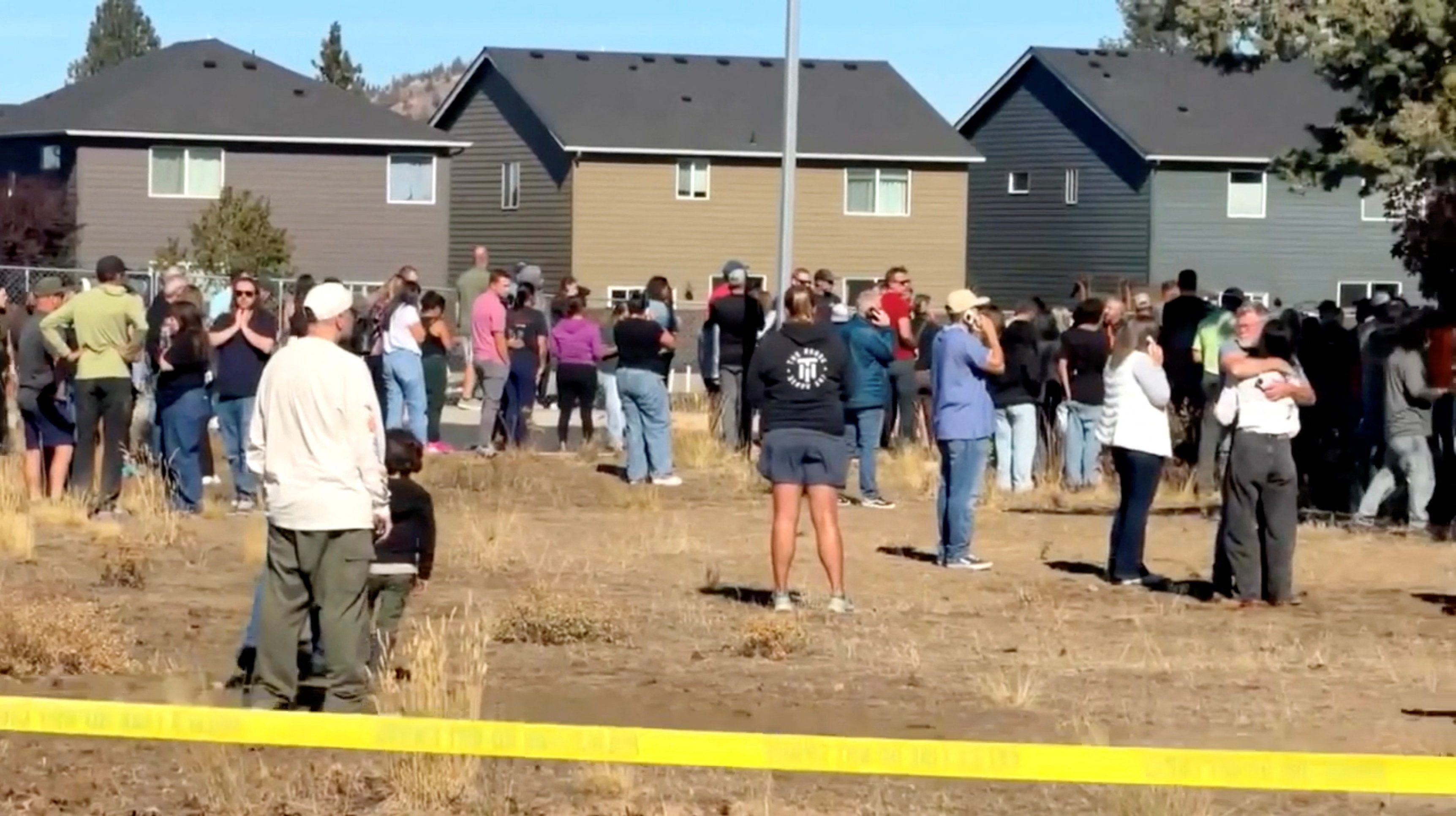 People stand near the scene of a shooting at Silver Rail Elementary School in Bend, Oregon, US, October 15, 2026, in this screengrab from a handout video.     ABC affiliate KOHD/Handout via REUTERS    THIS IMAGE HAS BEEN SUPPLIED BY A THIRD PARTY