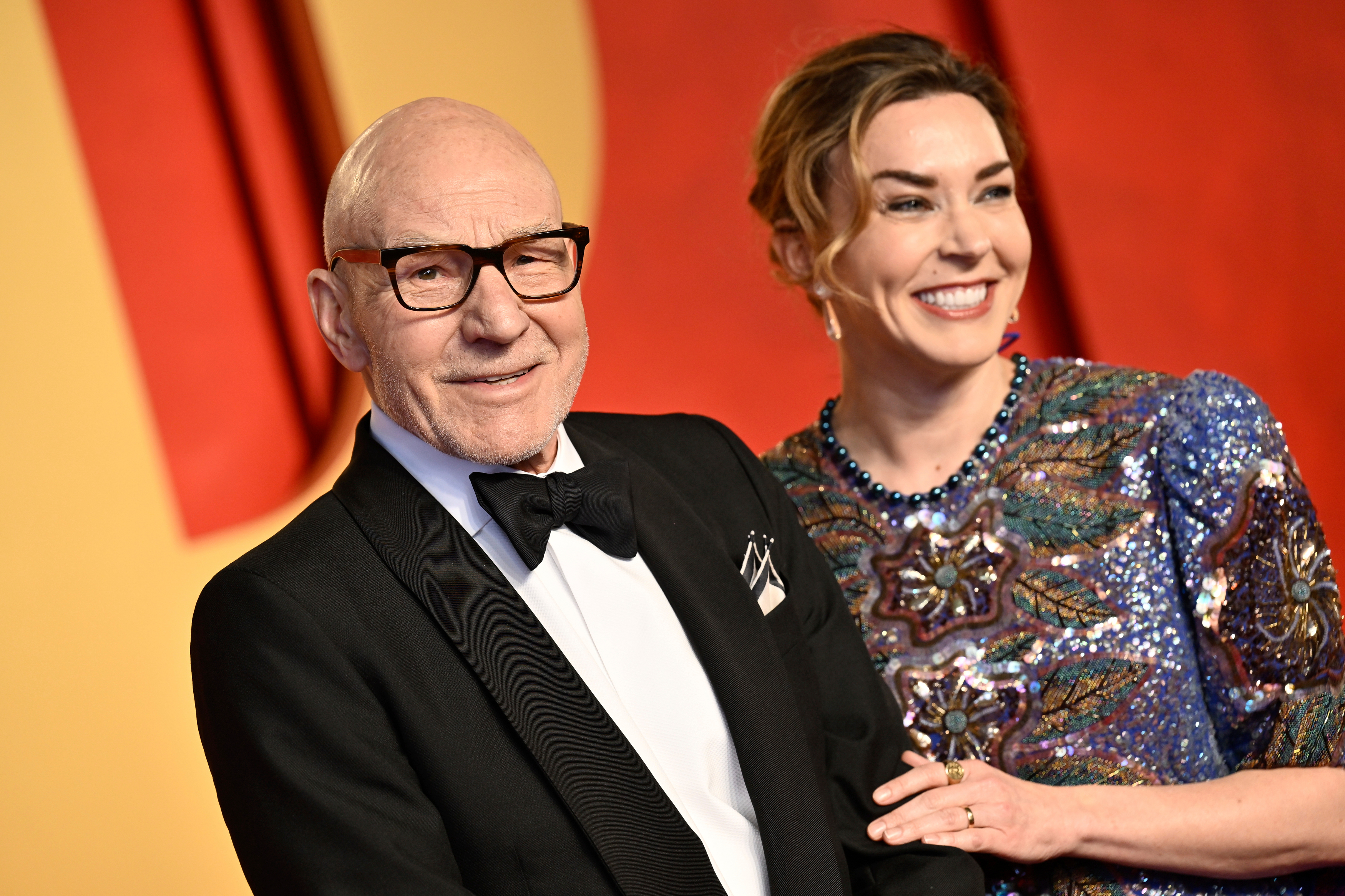 Patrick Stewart and his wife Sunny Ozell arrive at Vanity Fair's Oscar party in 2024.