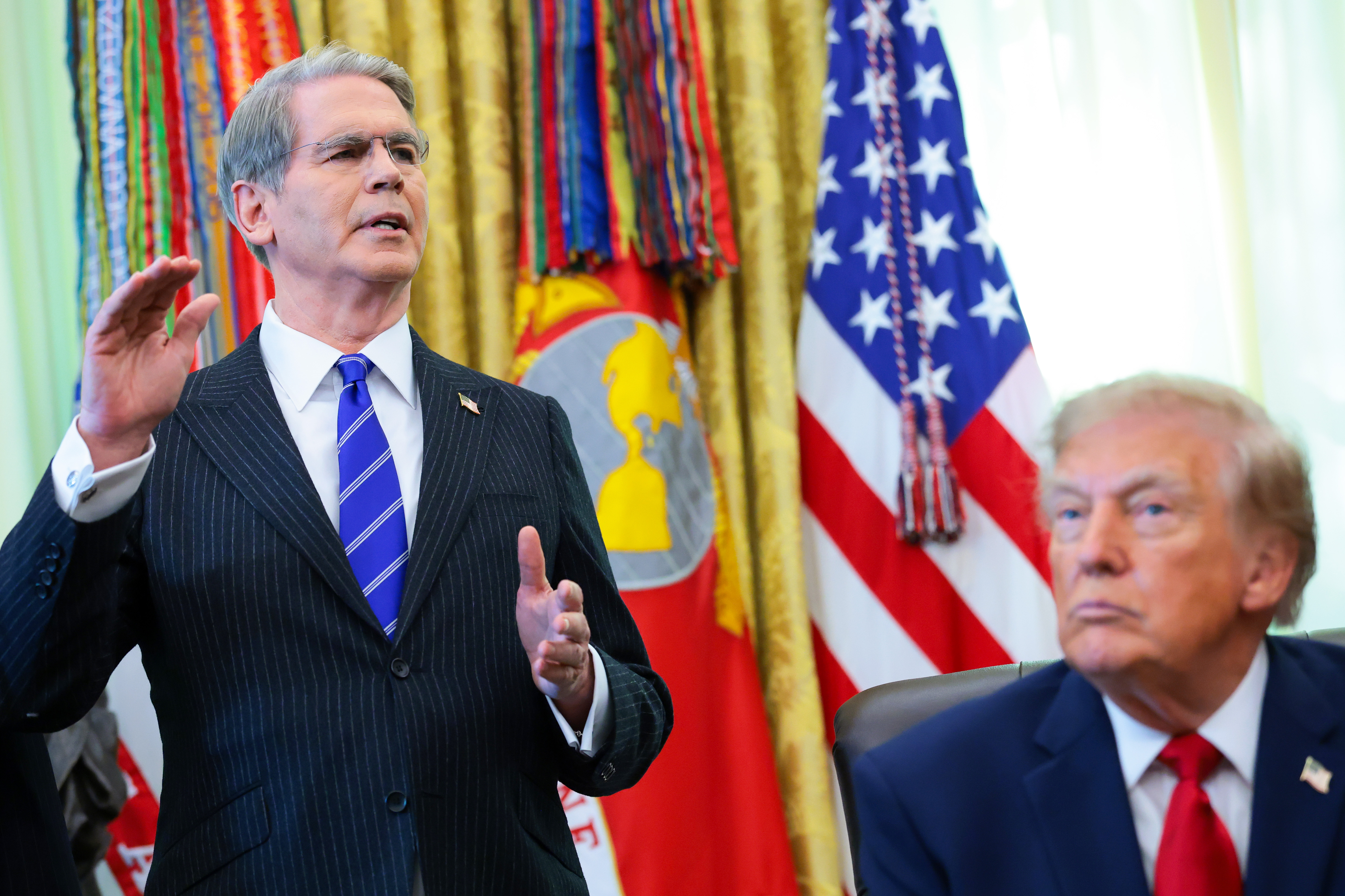 WASHINGTON, DC - OCTOBER 07: U.S. Treasury Secretary Scott Bessent (L) makes a statement alongside U.S. President Donald Trump  during an event in the Oval Office of the White House on October 07, 2026 in Washington, DC. President Trump announced that automatic enrollment in the $1,000 government seed deposit for children born between 2025 and 2028 known as "Trump Accounts" is now active. (Photo by Anna Moneymaker/Getty Images)