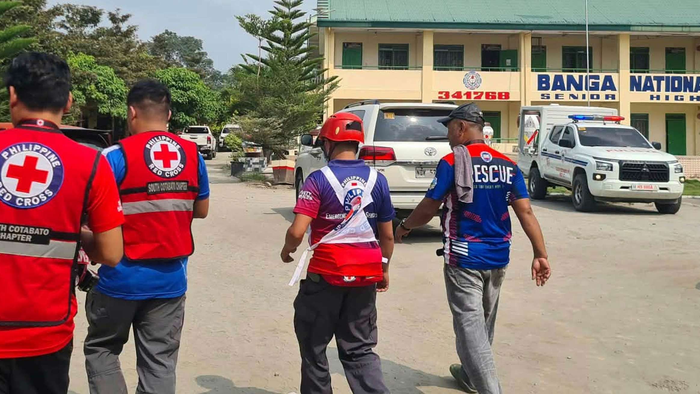 Police officers securing a high school campus in the Philippines
