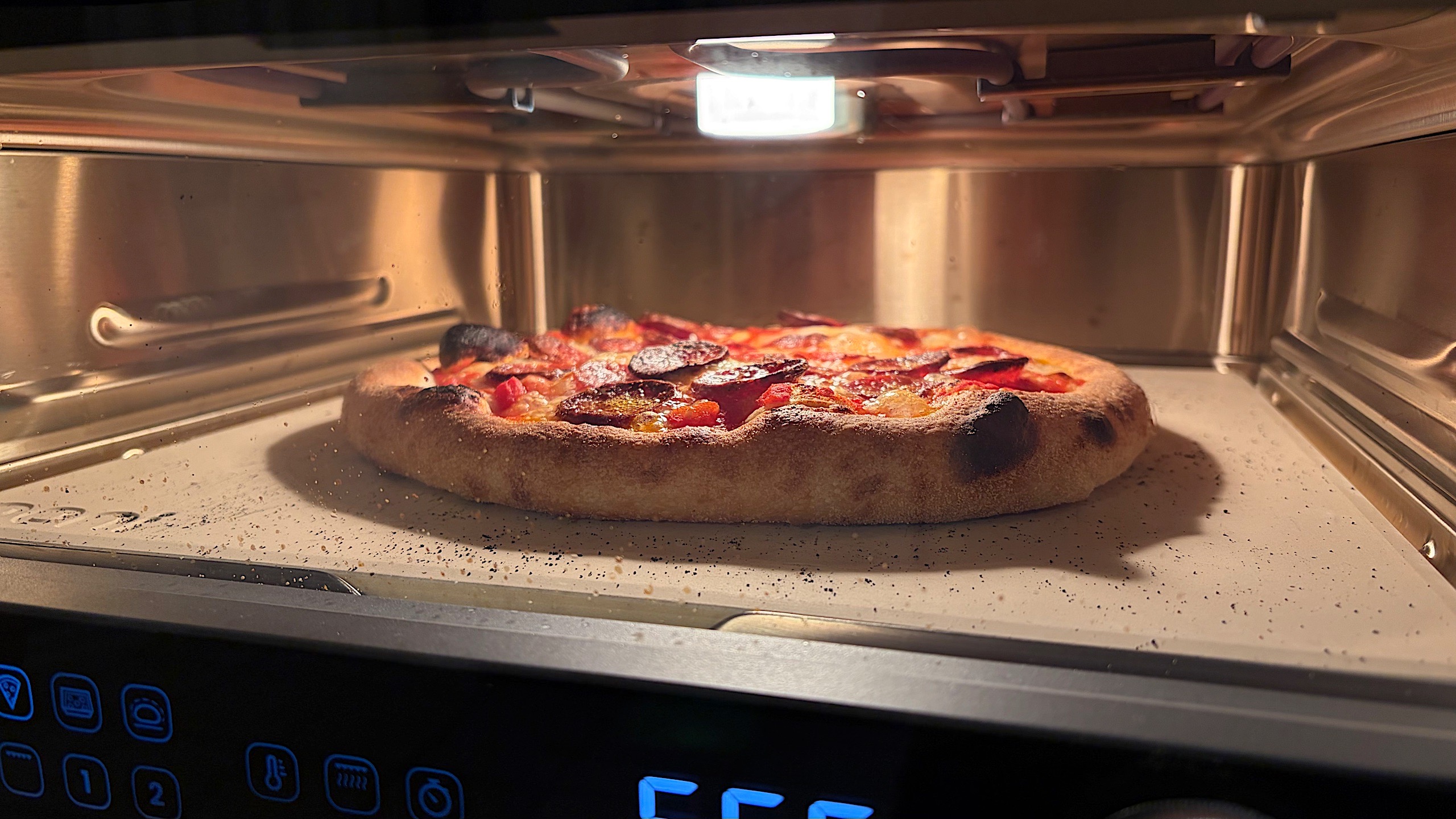 New York-style dough is baking with the Thin & Crispy preset on the Volt 2.