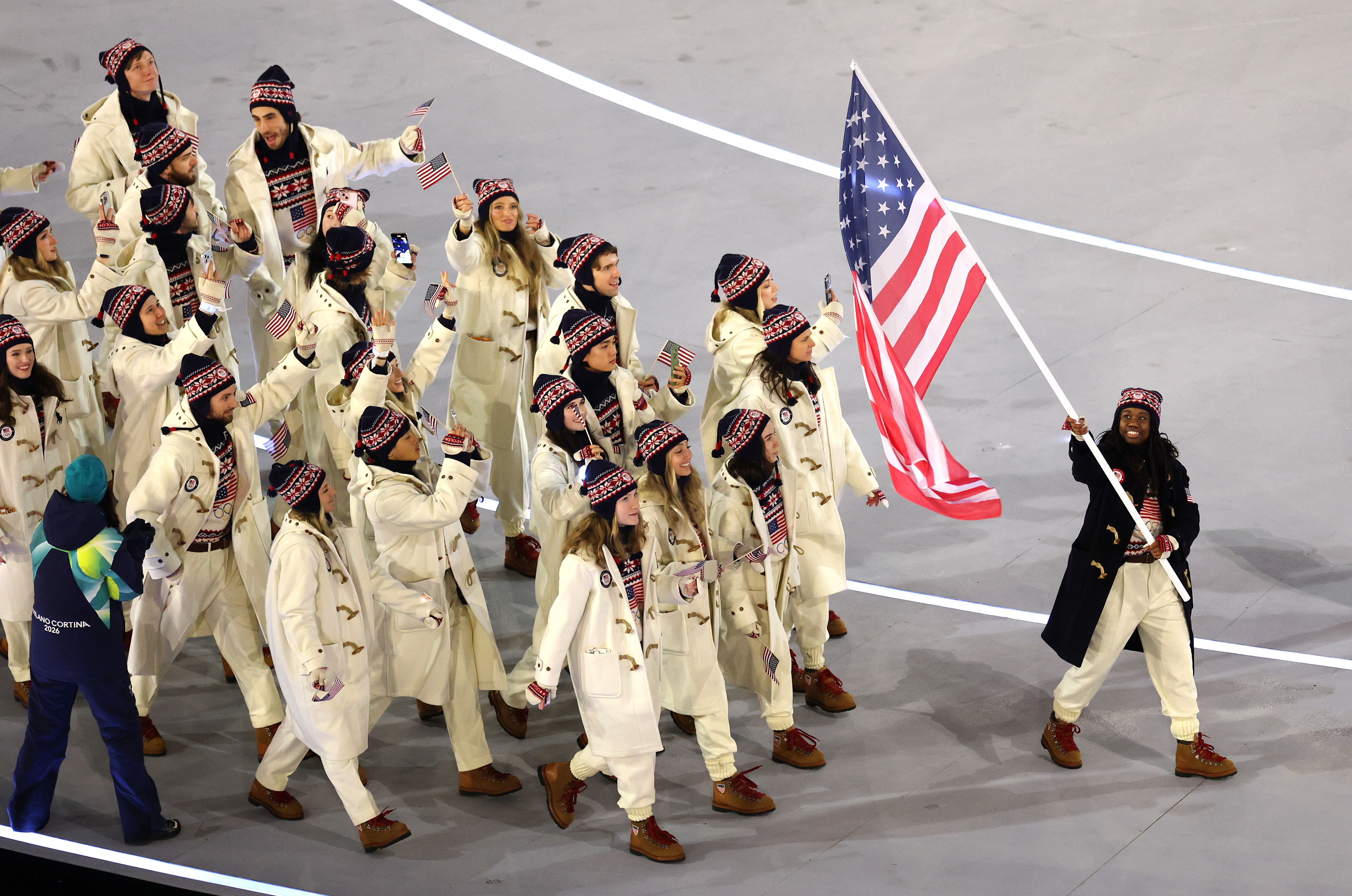 Team USA flagbearer Erin Jackson walks in the athlete parade with her teammates. (Maja Hitij/Getty Images)