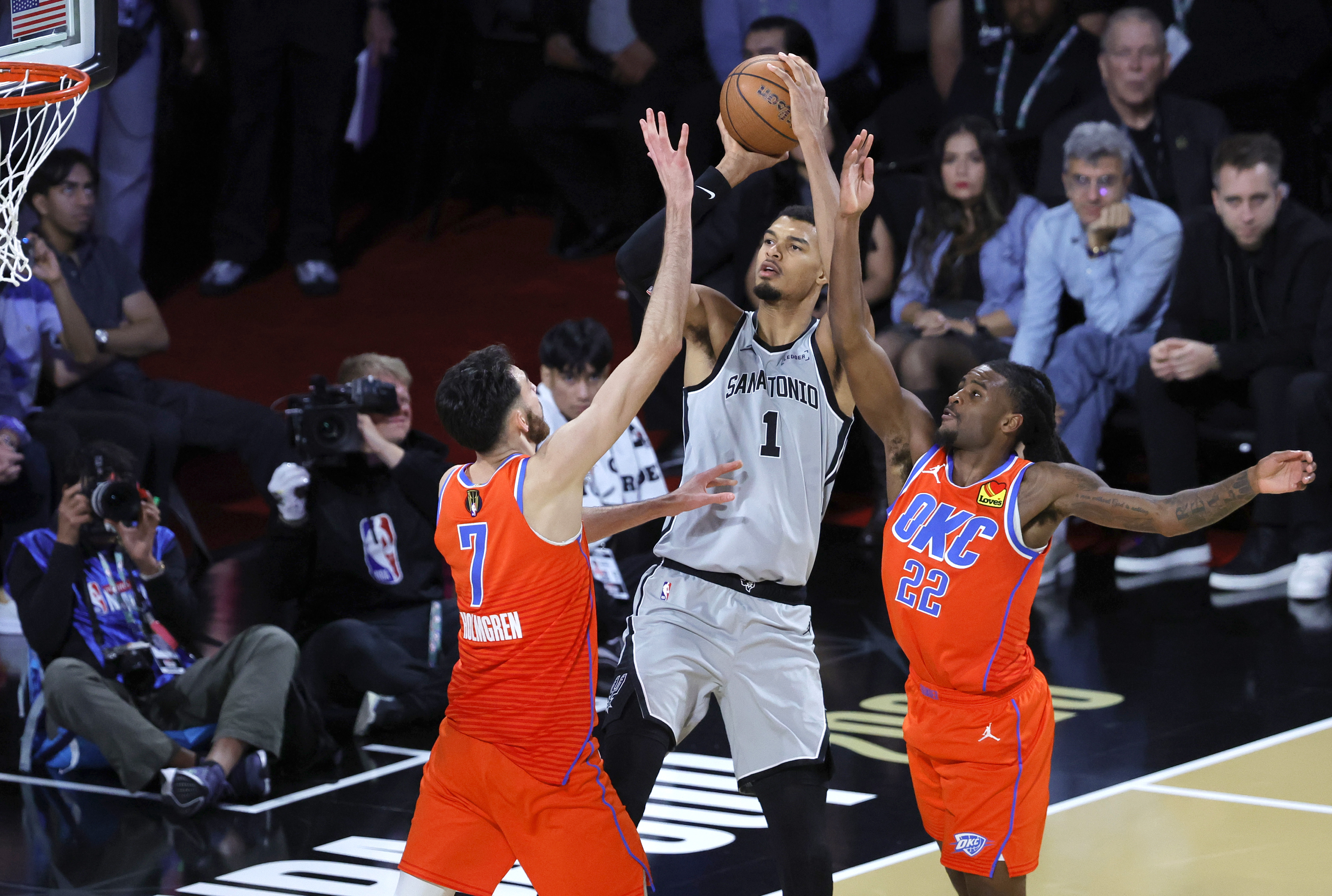 Wemby shoots over a pair of defenders in their first matchup this season. (Steve Marcus/Getty Images)