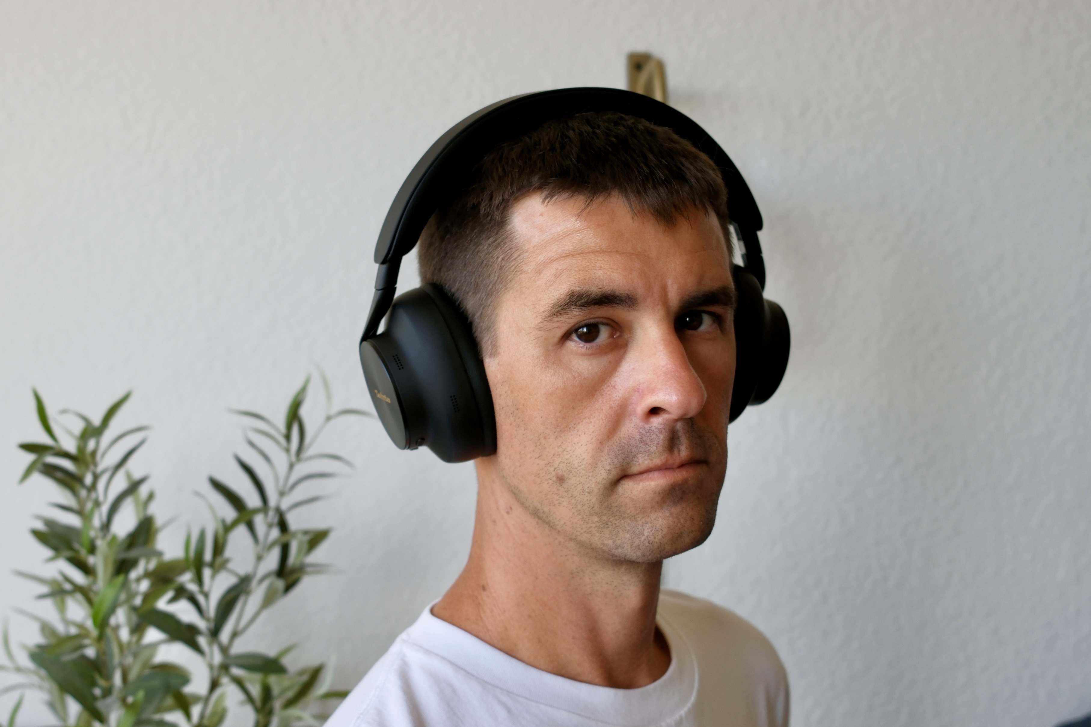 Person wearing black A1000 headphones