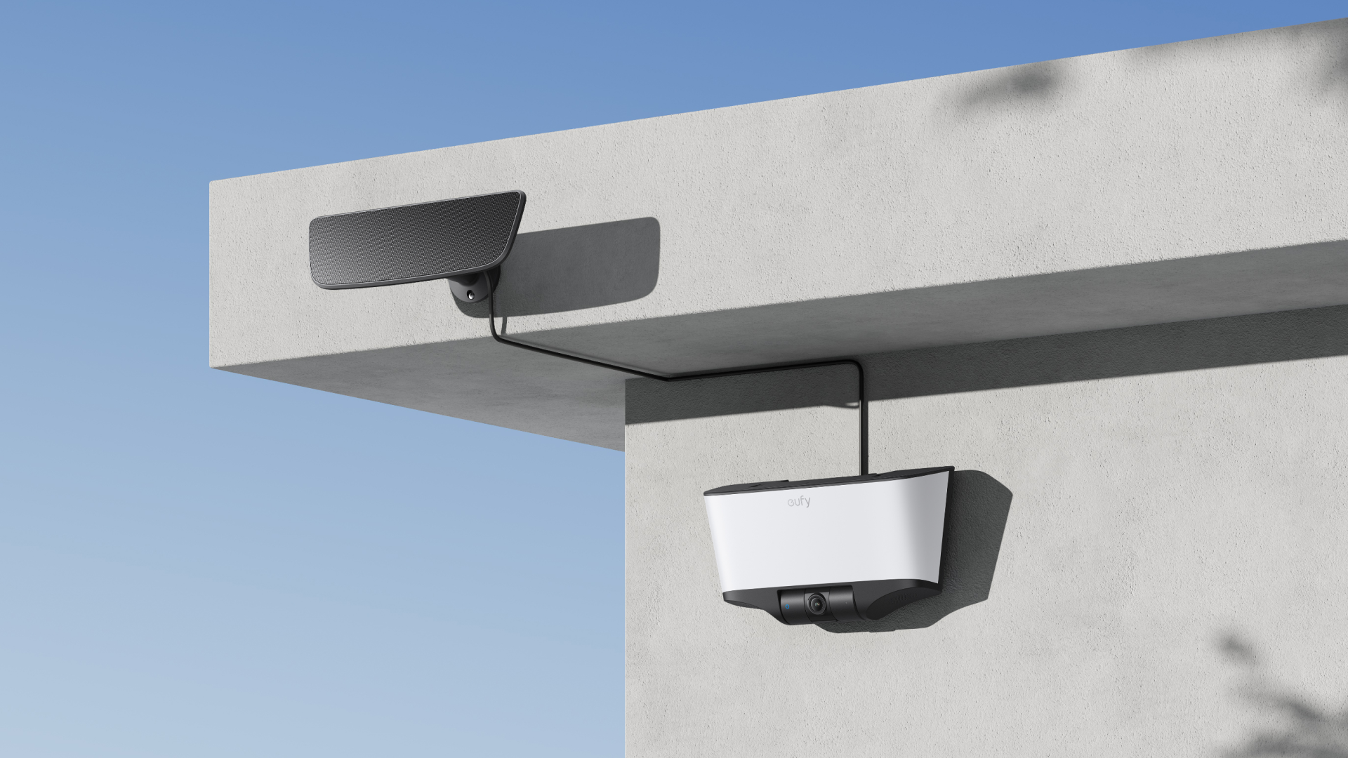 Product lifestyle photo of a solar-powered smart light mounted on an outdoor wall of a home