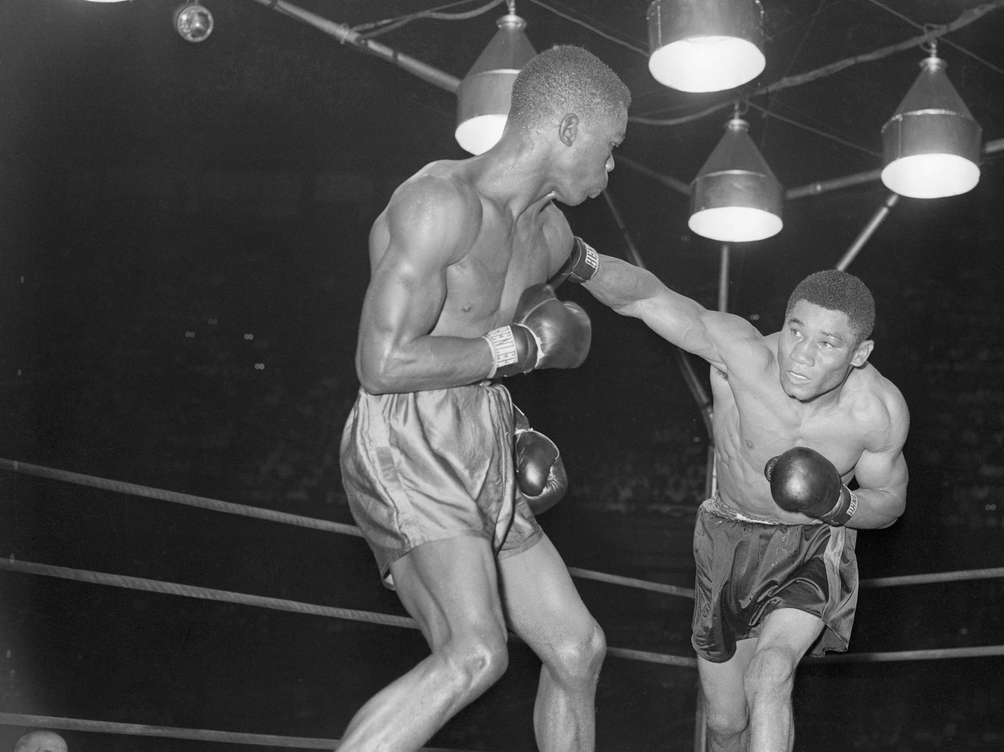 (Original Caption) Rock and Roll. Philadelphia: Beau Jack (R) throws a looping right as lightweight champion Ike Williams rocks back with the punch in 5th round of their scheduled 15-round bout in Shibe Park. Williams scored a TKO over Jack in 33 seconds of the sixth.