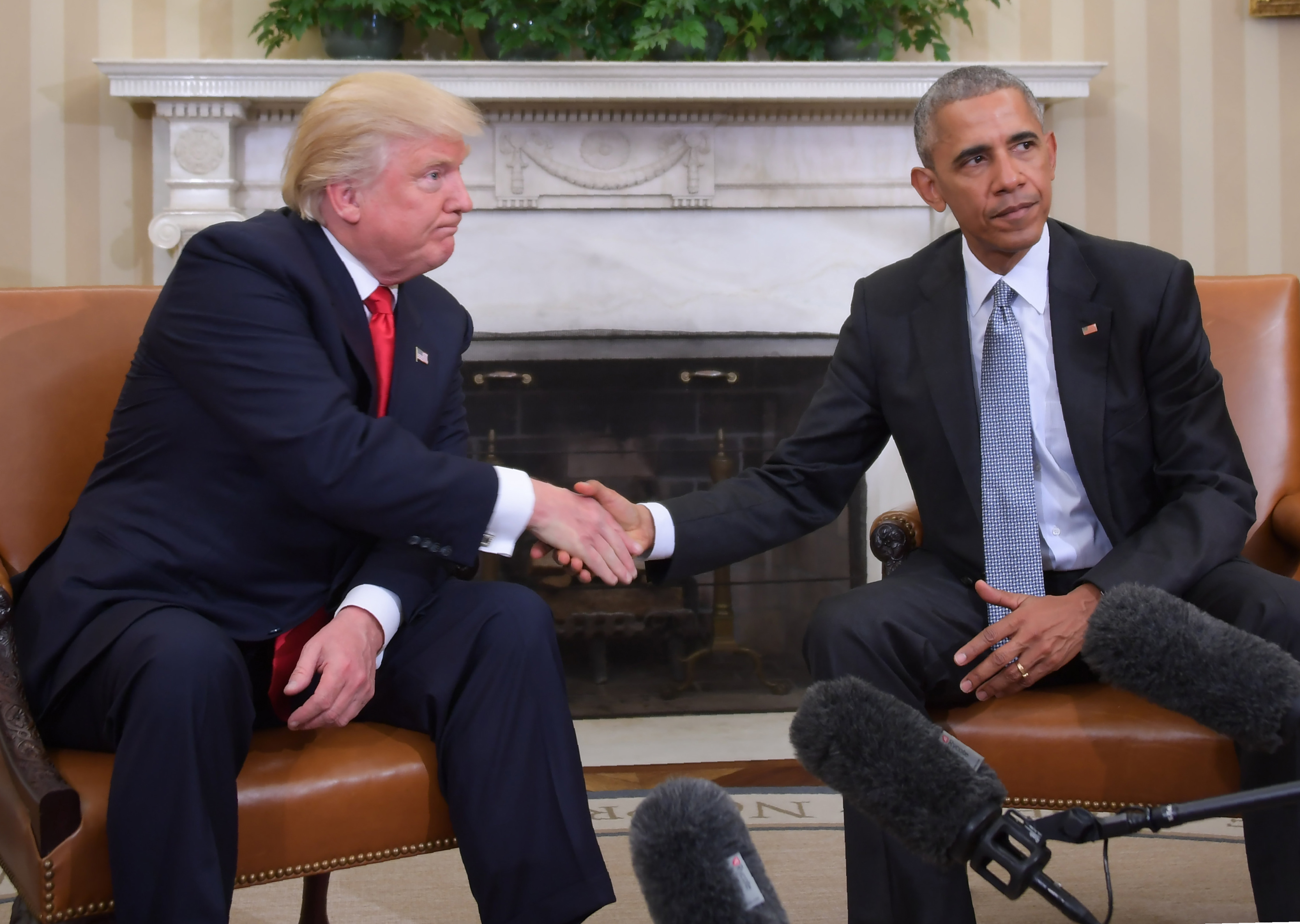 President-elect Donald Trump shakes hands with President Barack Obama during a meeting in the Oval Office, Nov. 10, 2016.