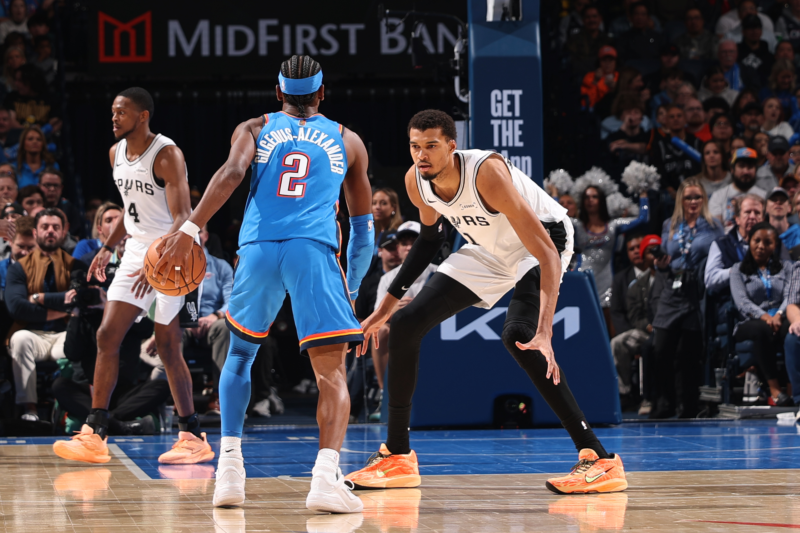 OKLAHOMA CITY, OK - JANUARY 13: Victor Wembanyama #1 of the San Antonio Spurs plays defense on Shai Gilgeous-Alexander #2 of the Oklahoma City Thunder during the game on January 13, 2026 at Paycom Center in Oklahoma City, Oklahoma. NOTE TO USER: User expressly acknowledges and agrees that, by downloading and or using this photograph, User is consenting to the terms and conditions of the Getty Images License Agreement. Mandatory Copyright Notice: Copyright 2026 NBAE (Photo by Zach Beeker/NBAE via Getty Images)