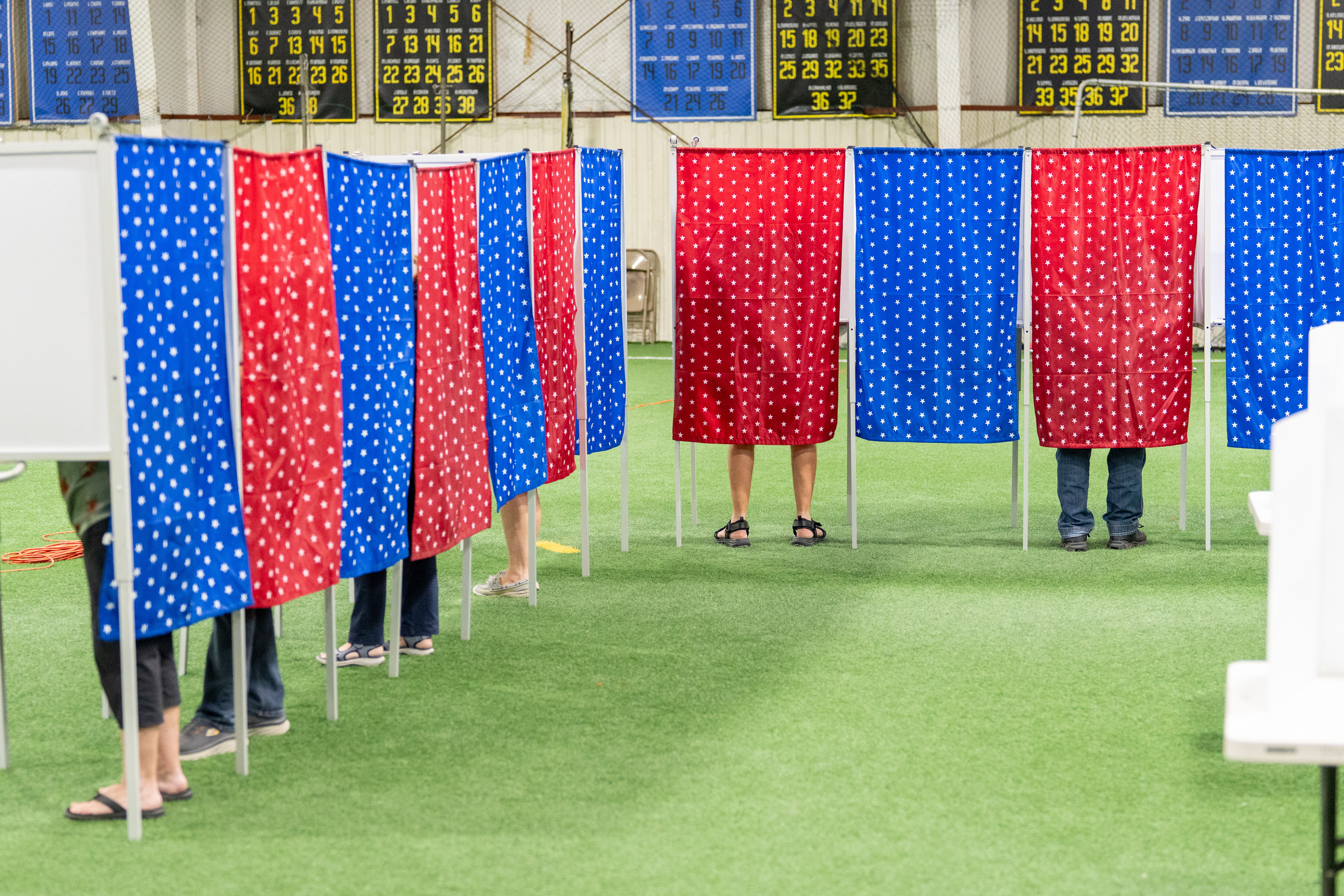 Voters cast their ballots at a polling location inside the Candia Youth Athletic Association during a primary election in Candia, New Hampshire.