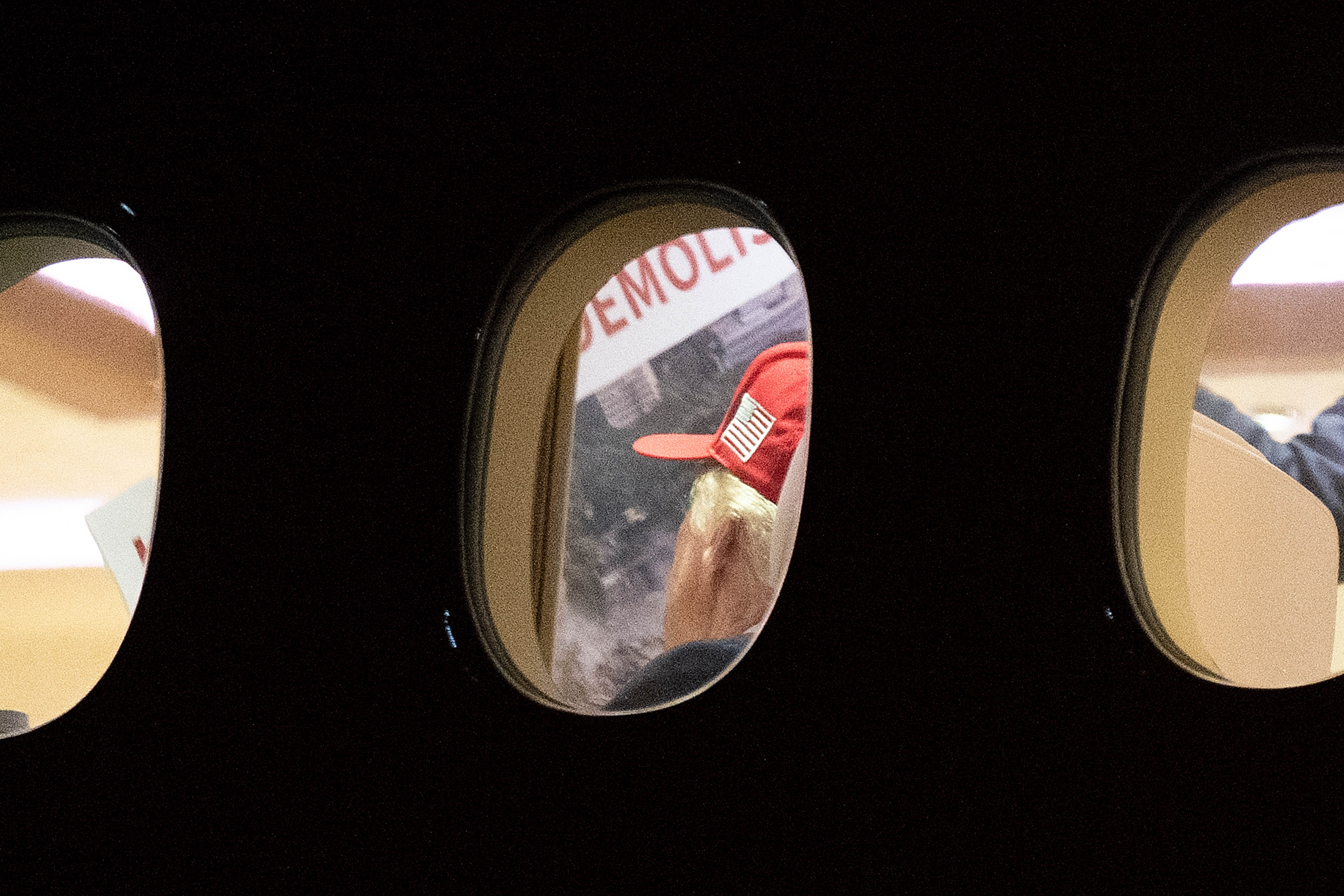 US President Donald Trump is seen aboard Air Force One checking a large Kennedy Center printout after landing at Joint Base Andrews, Maryland on September 16, 2026.