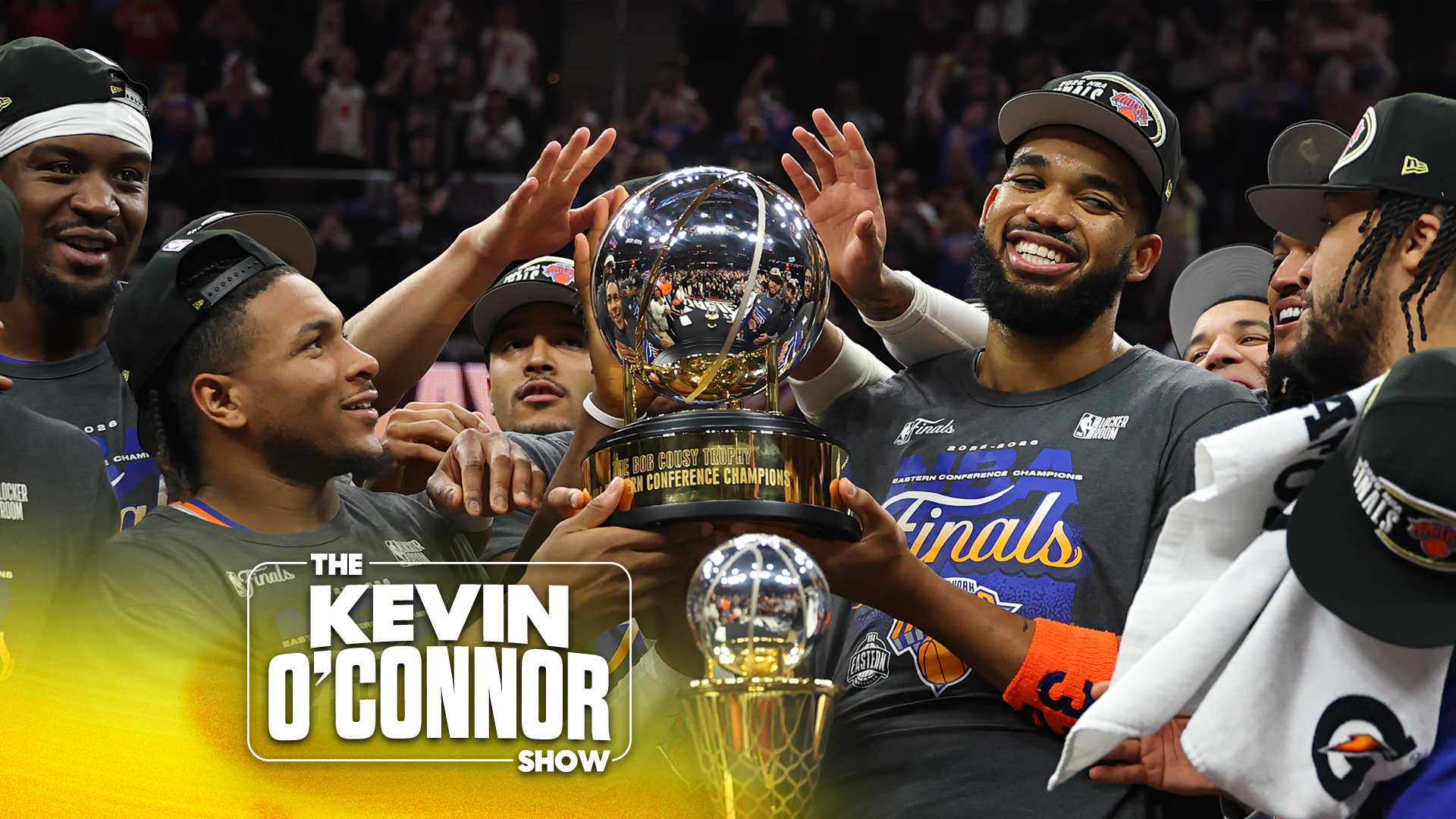 Karl-Anthony Towns and Miles McBride of the New York Knicks celebrate with the Bob Cousy Trophy after defeating the Cleveland Cavaliers 130-93 in Game Four of the NBA Eastern Conference Finals at Rocket Arena on May 25, 2026 in Cleveland, Ohio. (Photo by Gregory Shamus/Getty Images)