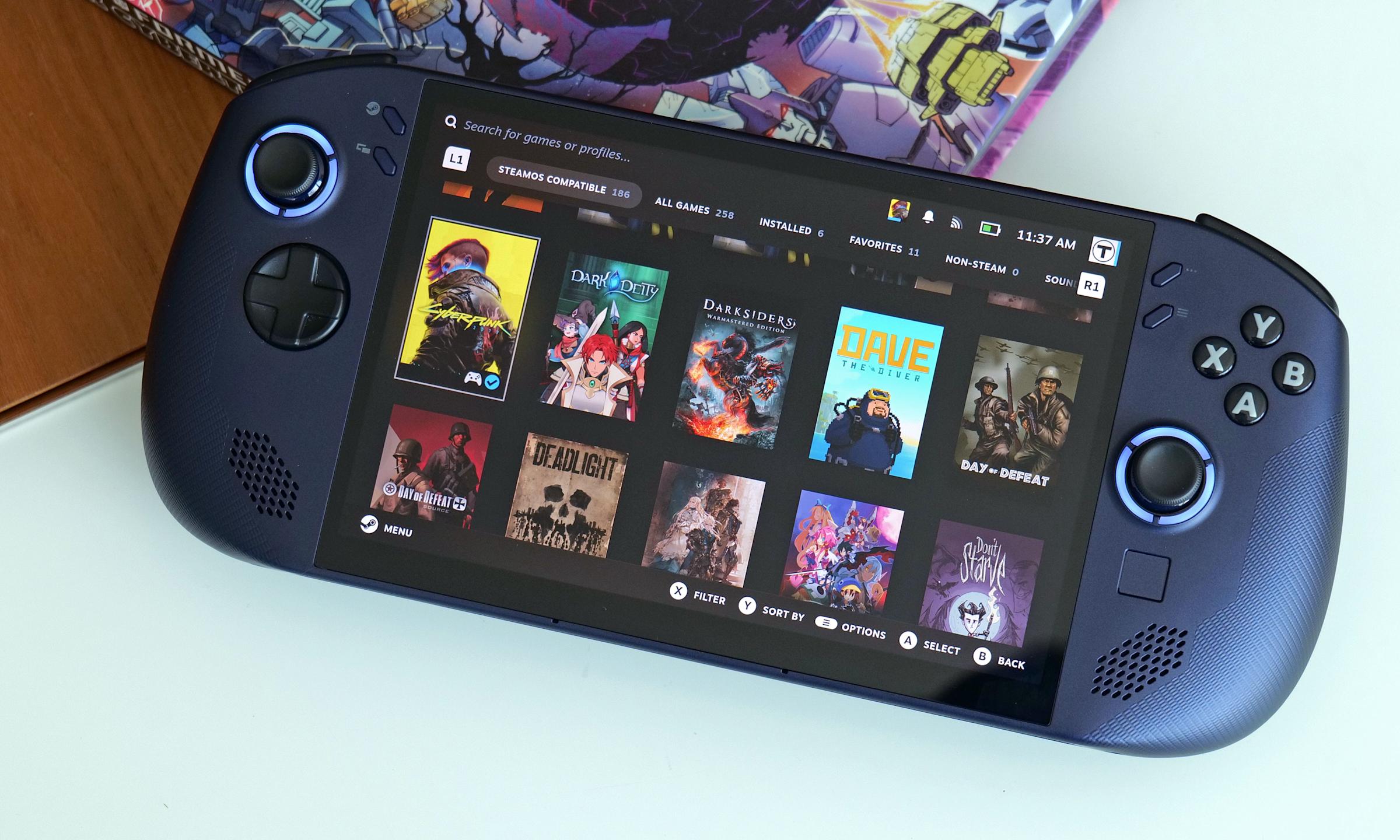 The Lenovo Legion Go S sits on an opaque glass table with a comic book behind it. 