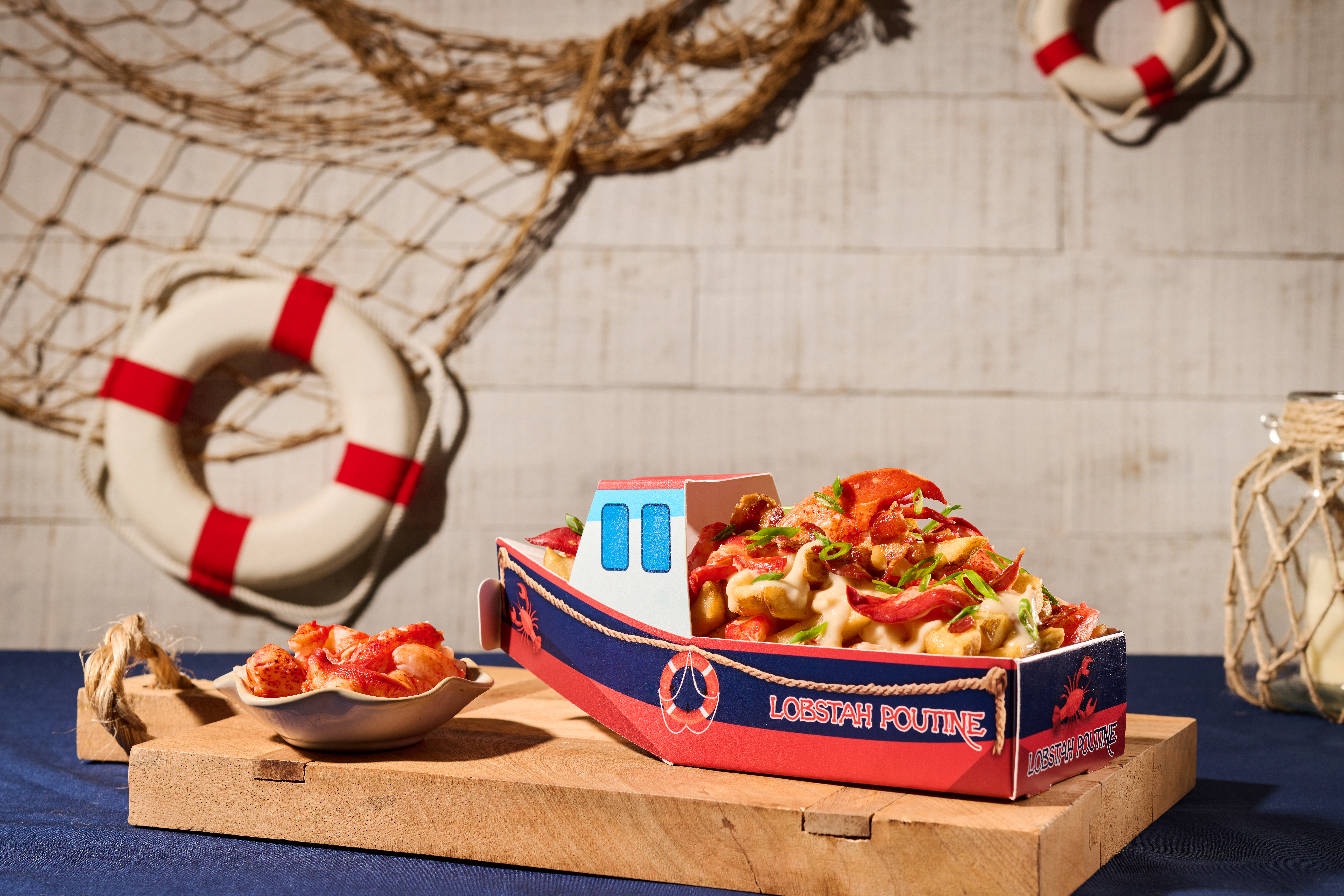 At Fenway Park, fans can purchase "Lobstah Poutine," which comes in its own boat-shaped bowl.