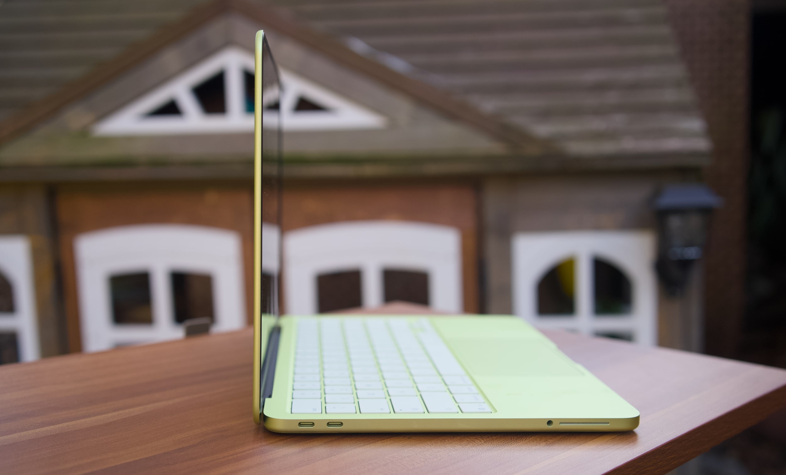 A citrus MacBook Neo's USB-C ports.