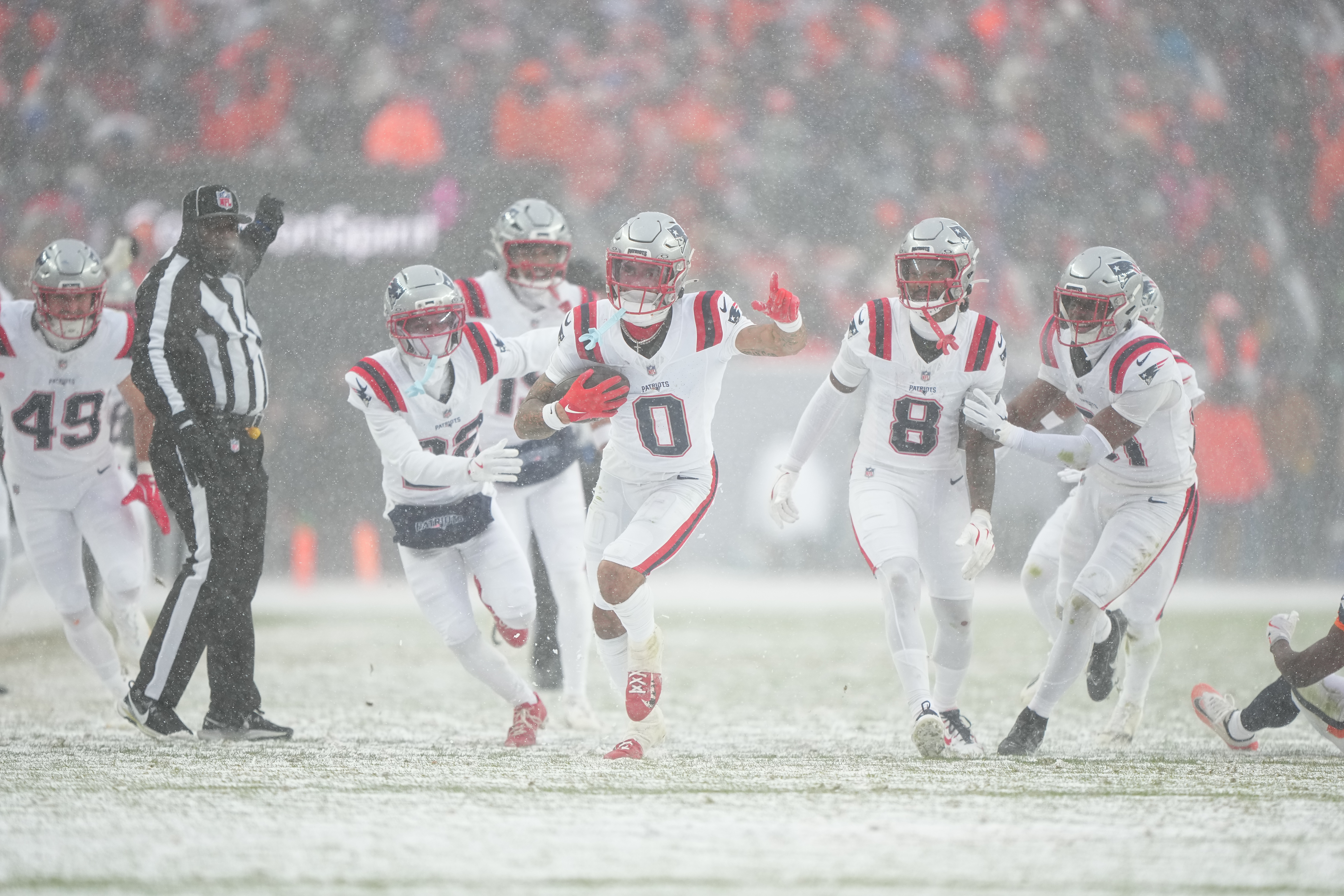 The Patriots defense celebrates a fourth-quarter interception. (Bart Young/AP Photo)