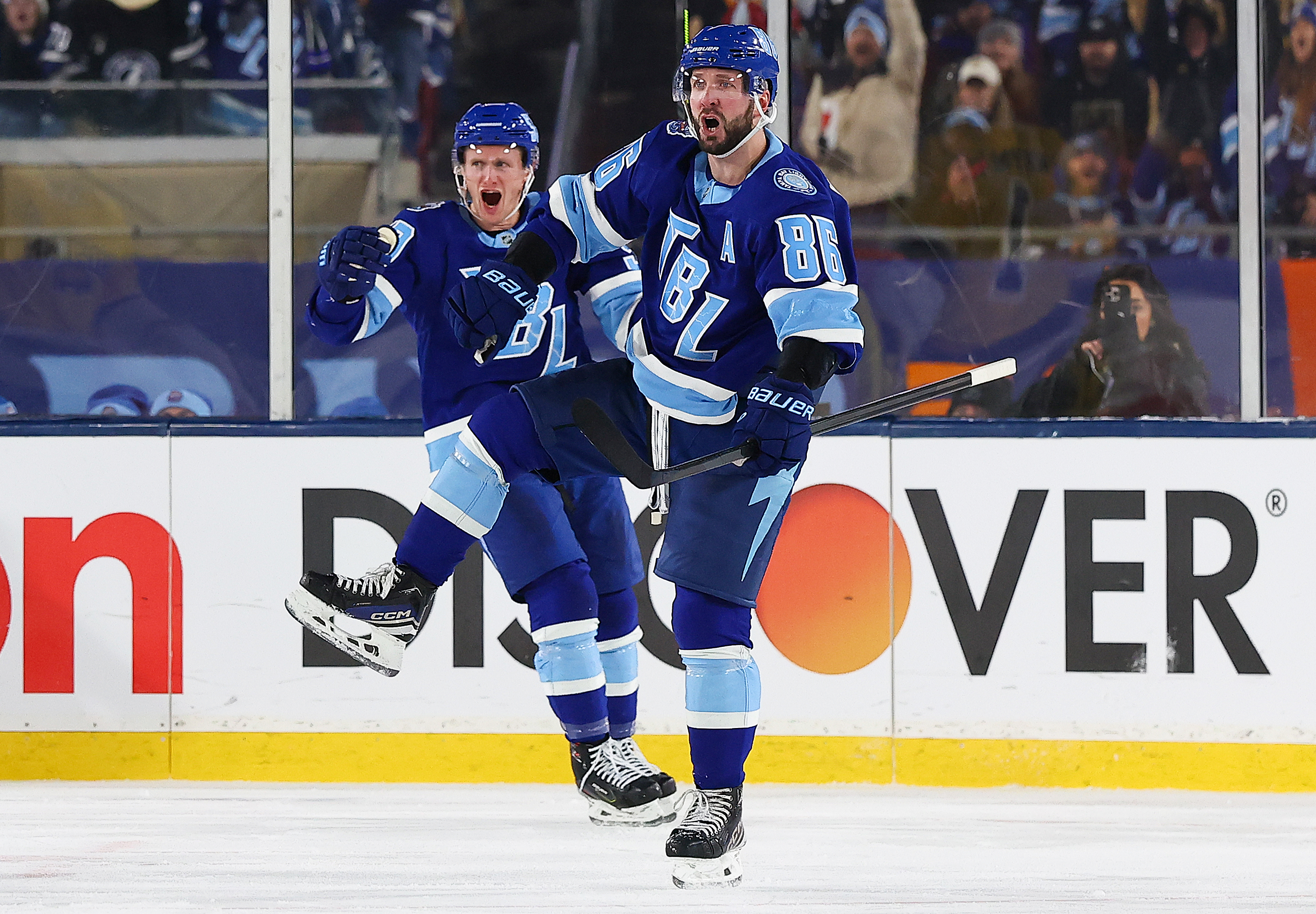 Kucherov (R) celebrates after scoring a goal during the Stadium Series. (Mike Carlson/Getty Images)