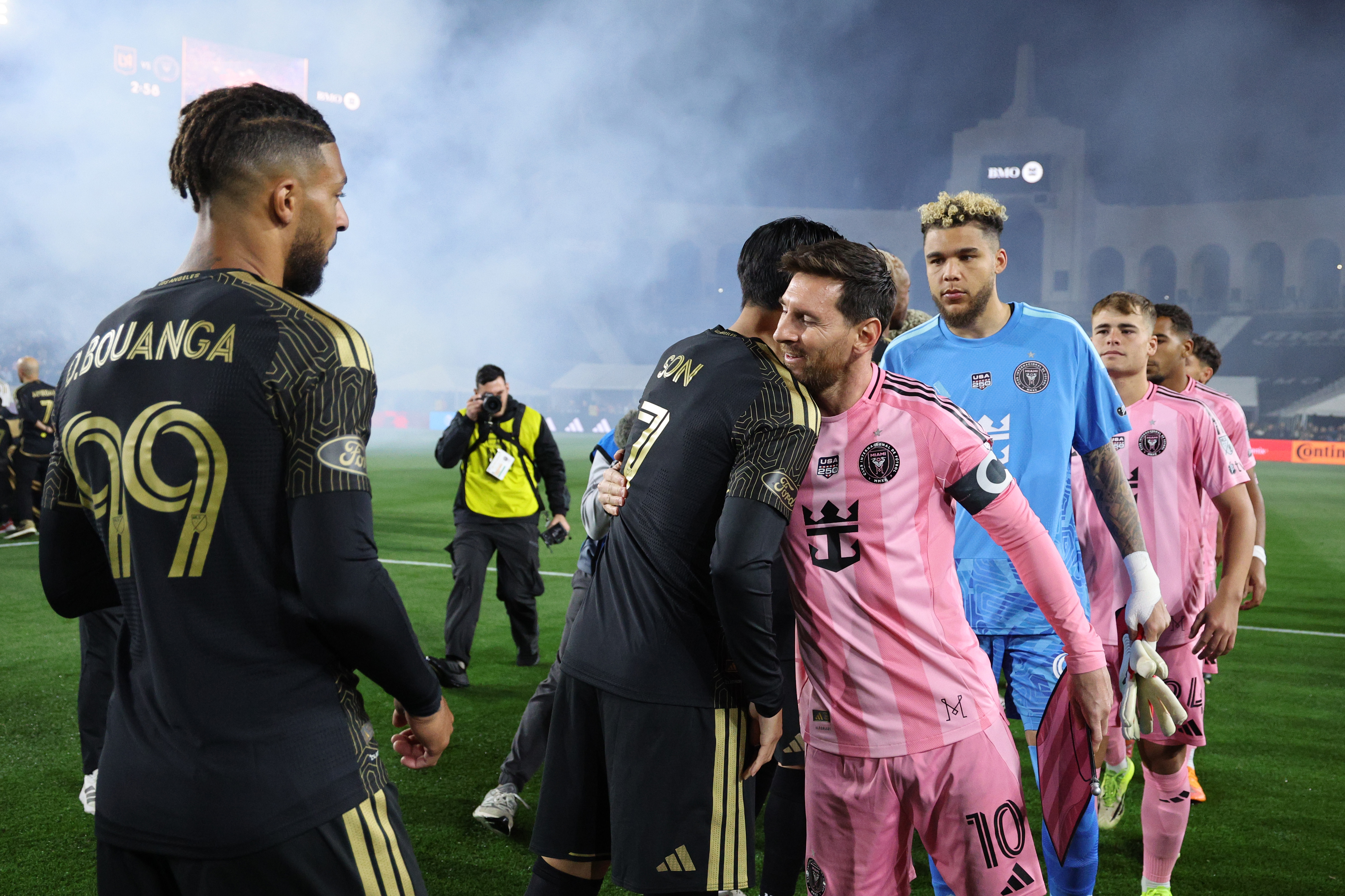 Lionel Messi and Son Heung-Min hug ahead of their season-opener. (Kevork Djansezian/Getty Images)