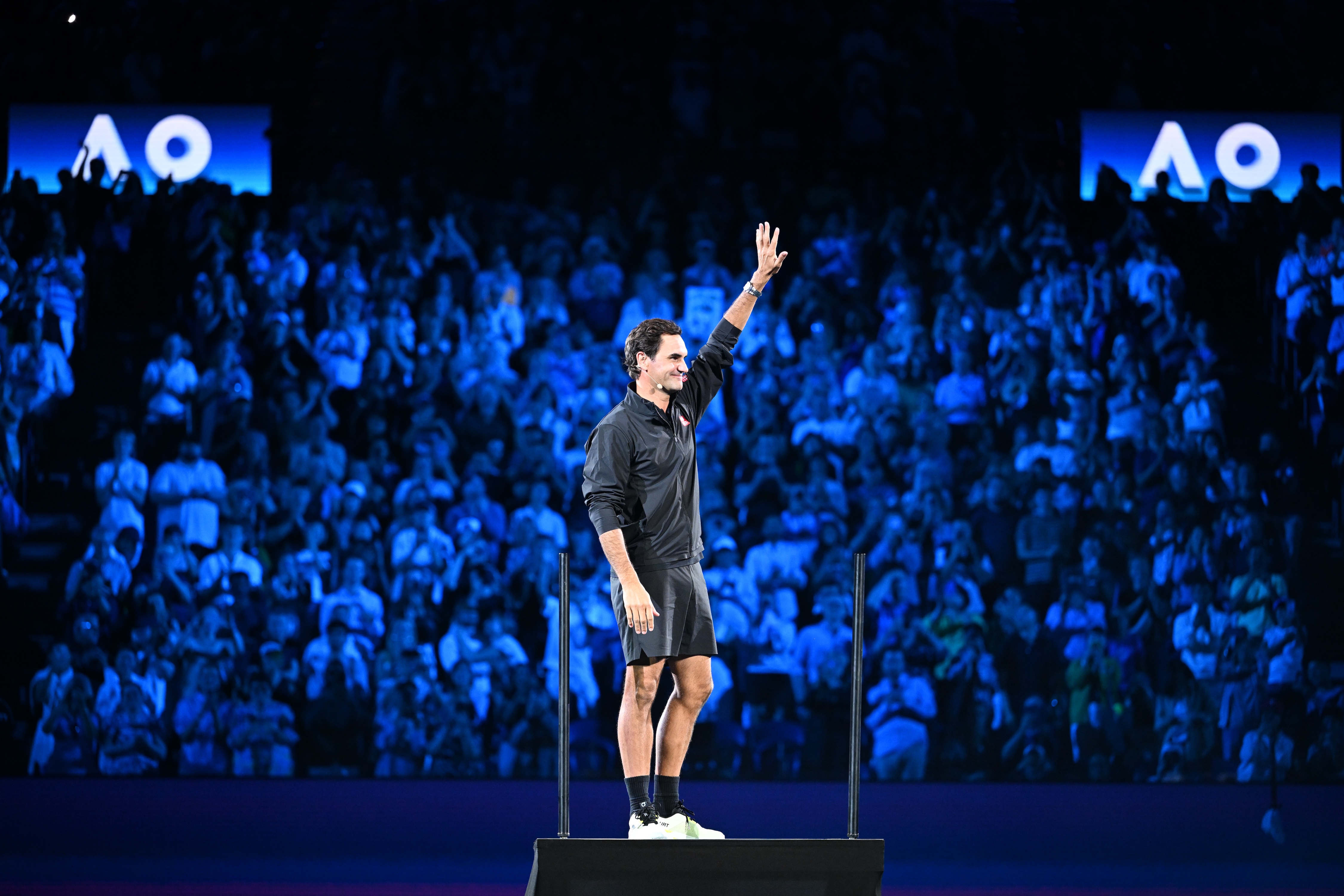 Federer waves goodnight to the crowd. (James D. Morgan/Getty Images)